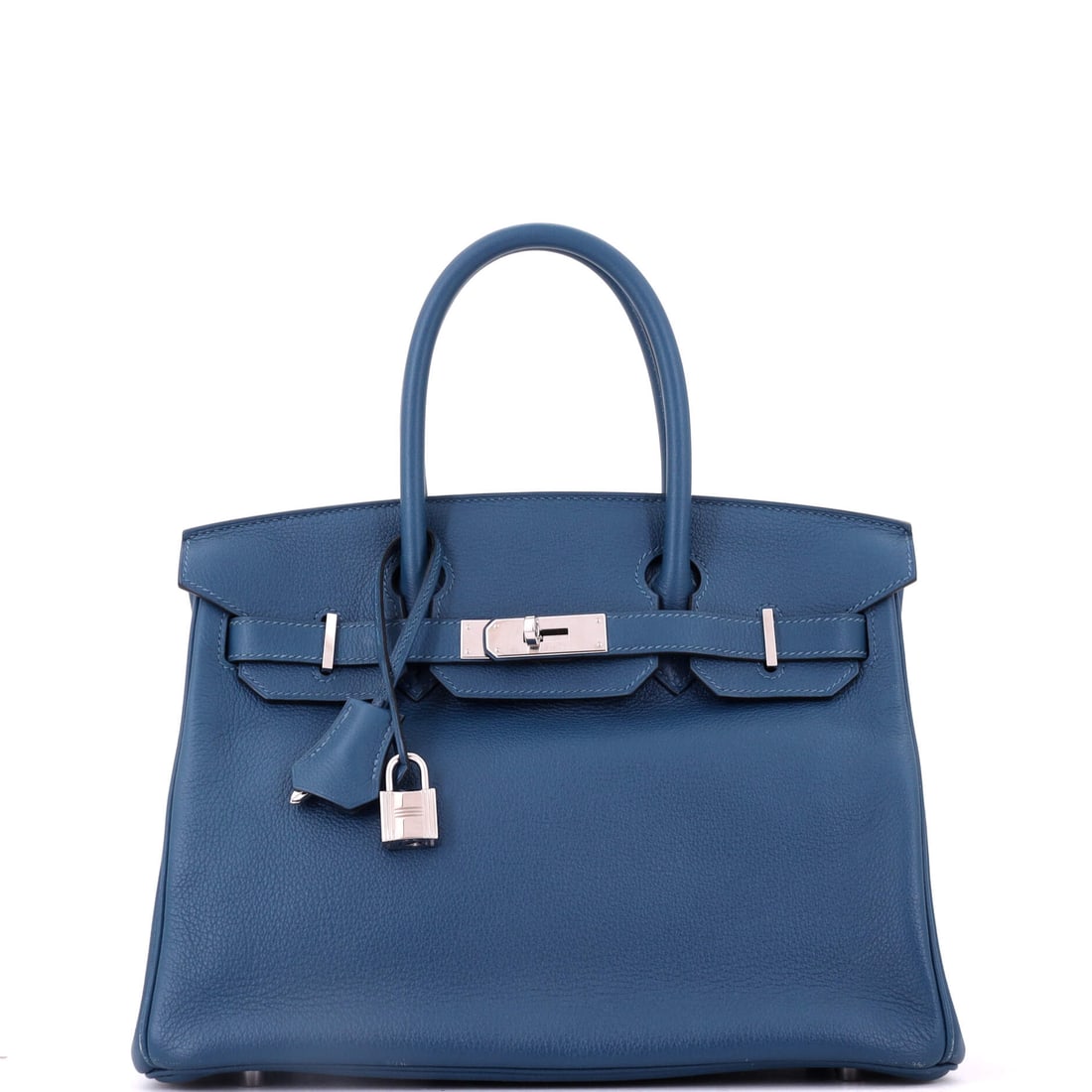 Hermes Birkin Handbag Blue Novillo with Palladium Hardware: Boxy through the base, tapered at the flap, unmistakable at ten paces: the Birkin 30 shape does not depend on the leather, though Novillo gives it a rounder grain than Togo. Blue over that older grain