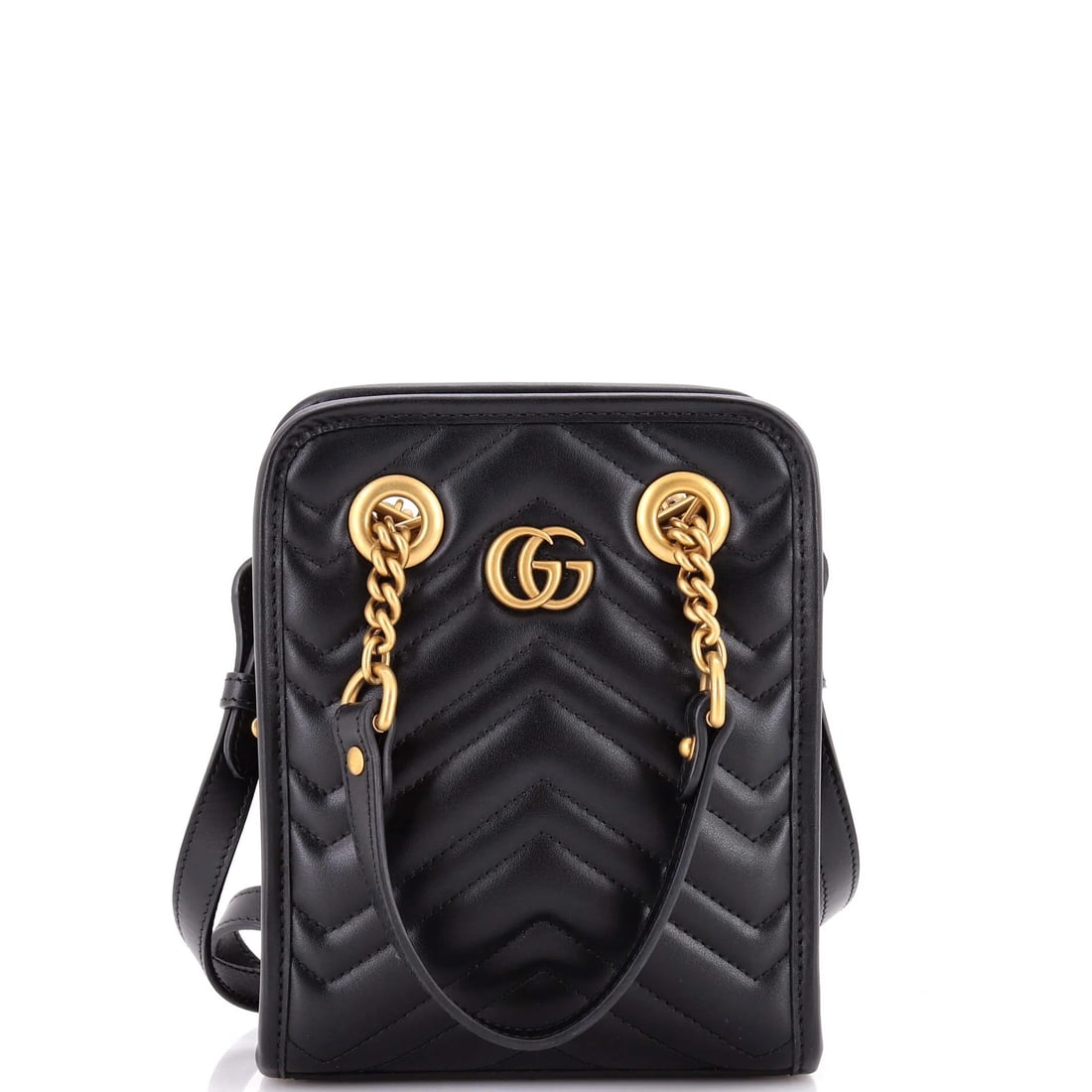 Gucci GG Marmont Handle Crossbody Bag Matelasse Leather Mini: This is the vertical Marmont: 6 inches wide against 7.5 inches tall, with 3 inches of depth, which makes it stand upright on a table instead of lying flat like the flap bags. A top handle sits above t