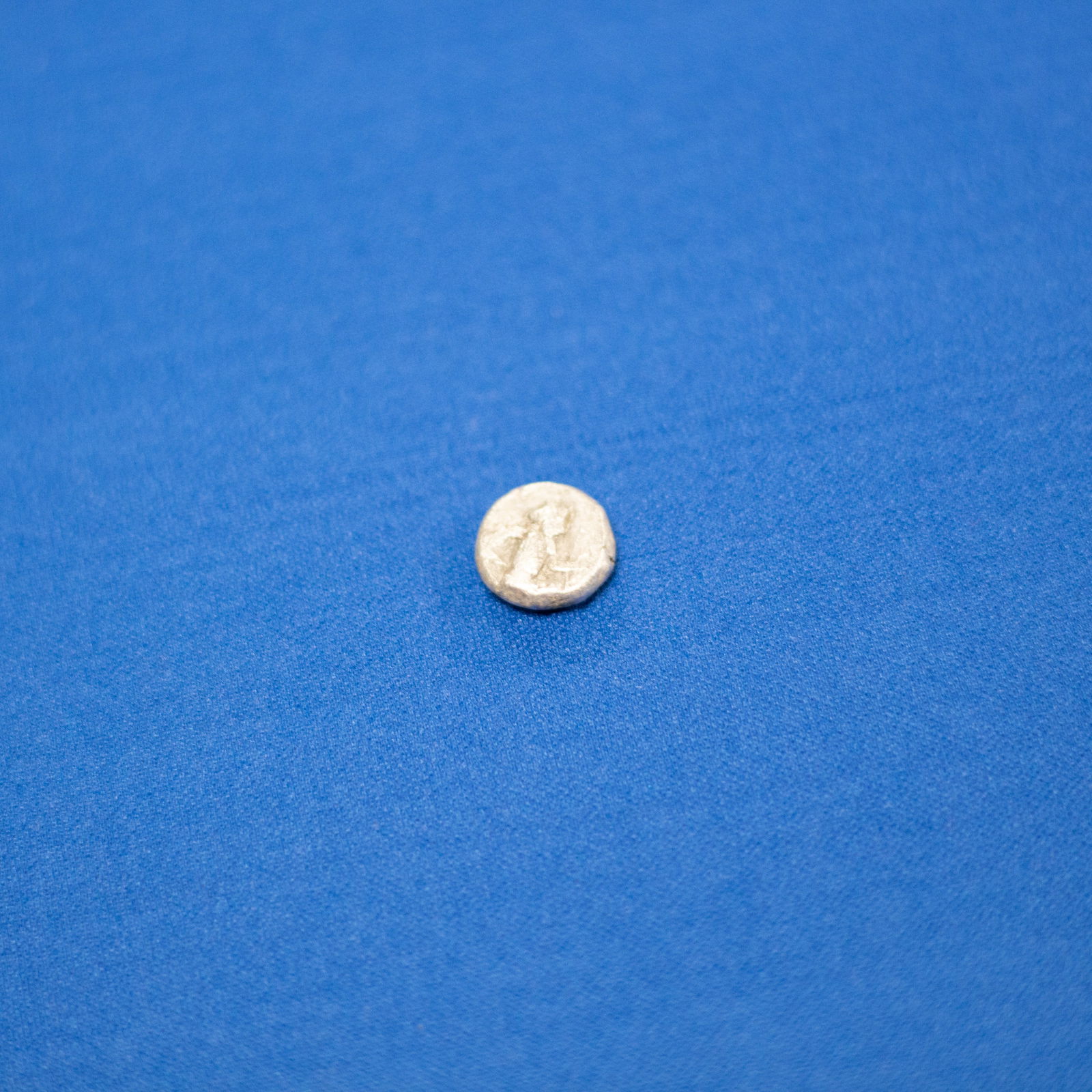 COIN: SIGLOS Type IV ACHAEMENID (553-330 BC): This is a silver siglos of the Achaemenid Empire struck at Sardis between circa 455–330 BC. The obverse depicts the Great King in the traditional kneeling-running stance, holding a bow and dagger, w