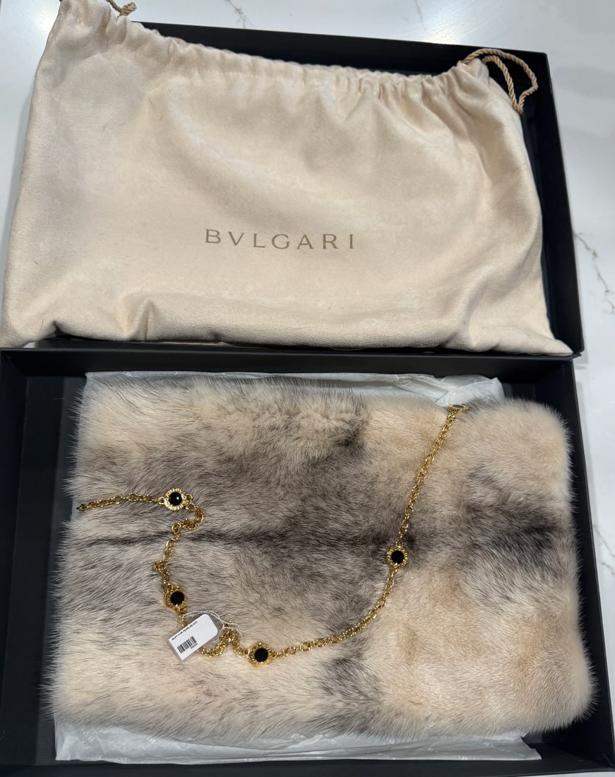 Bvlgari mink fur muff with chain strap: pink lining, interior zip pocket, fur color pearl/black. 13” x 9”. Box & dust bag included