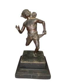 Bronze Depiction of a Sports  Player in Motion