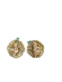 Pair of vintage porcelain wall plaques