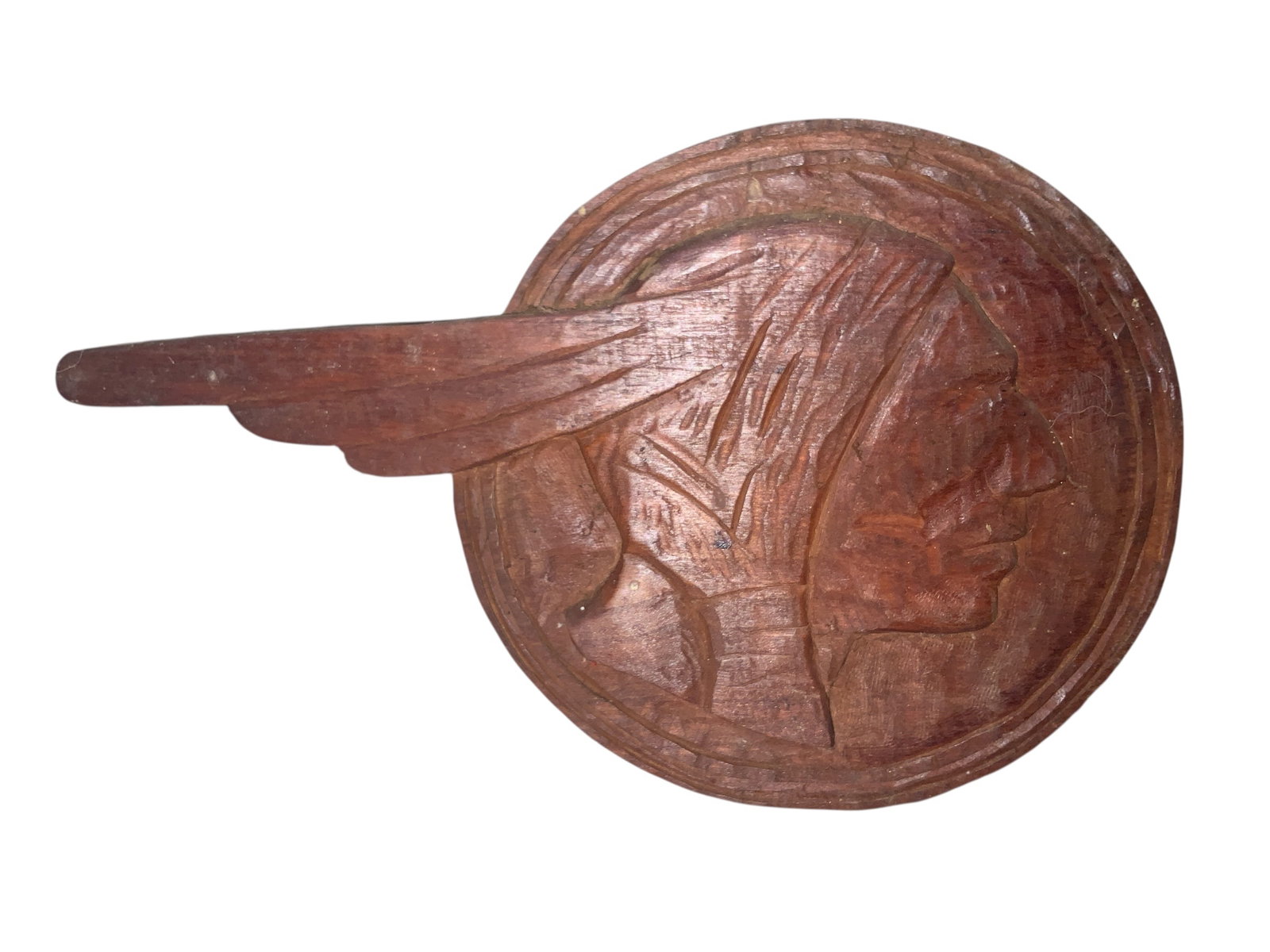Single-sided Native American Chieftan’s Head Carved onto Wood: Good Condition. Personalized on reverse.6 1/2” diameter10 1/2” across the feather.