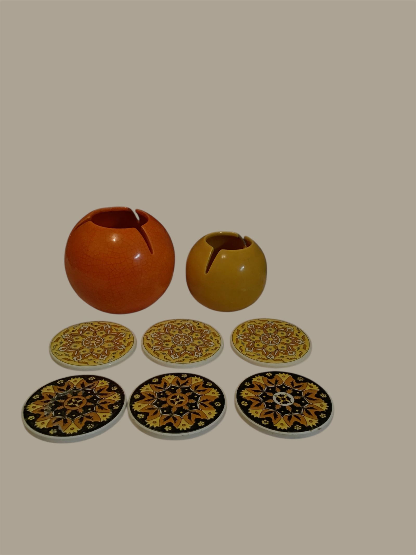 2 Mid-Century Ashtray and 6 Ceramic Coasters: 2 Mid-Century AshTrays and 6 Ceramic Coasters AshTrays are both unsigned Lg ashtray is 5 inches in diameter 5 inches Tall. Small ashtray is 3 1/3 inches in diameter 3 1/2 inches tall Coasters are 3 1/