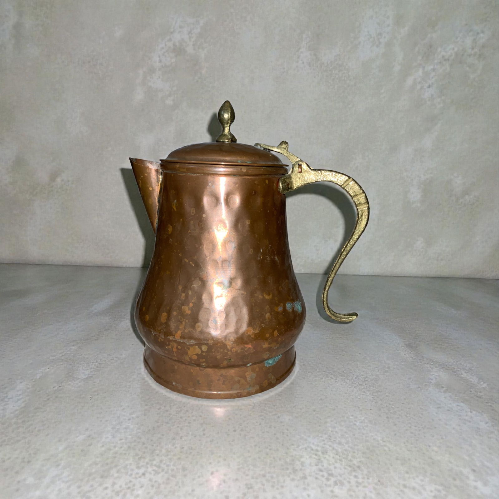 Antique Hammered Copper Tea / Coffee Pot Water Pitcher Brass Handle / Finial: Antique Copper Tea / Coffee Pot Water Pitcher Brass Handle / Finial. Wear and patina consistent with significant age. 8” tall