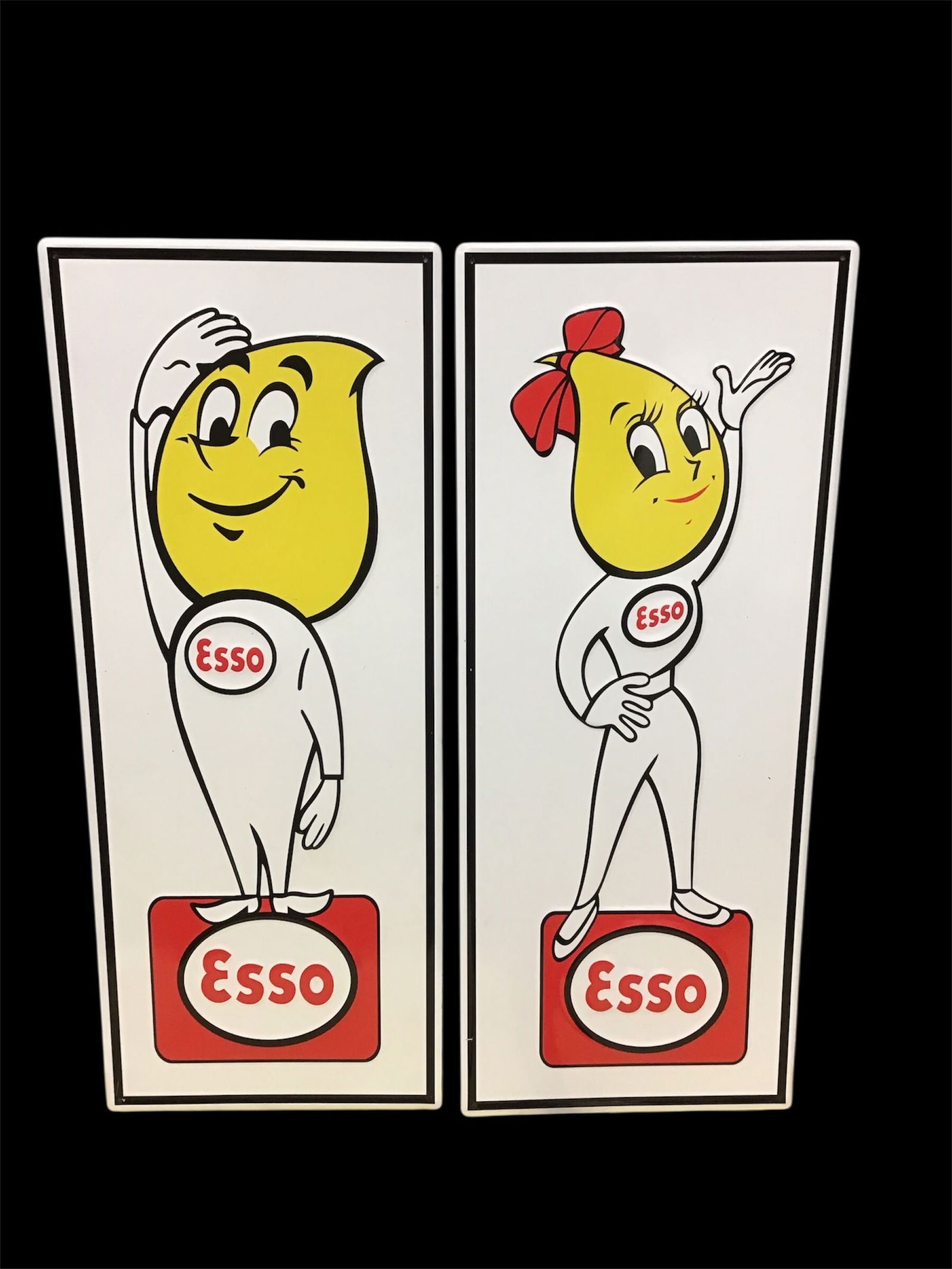 Pair of reproduction Embossed Esso Gasoline metal signs: Pair of reproduction embossed Esso Gasoline metal signs Bright colors and heavy metal24 inches tall 10 inches wide in excellent condition