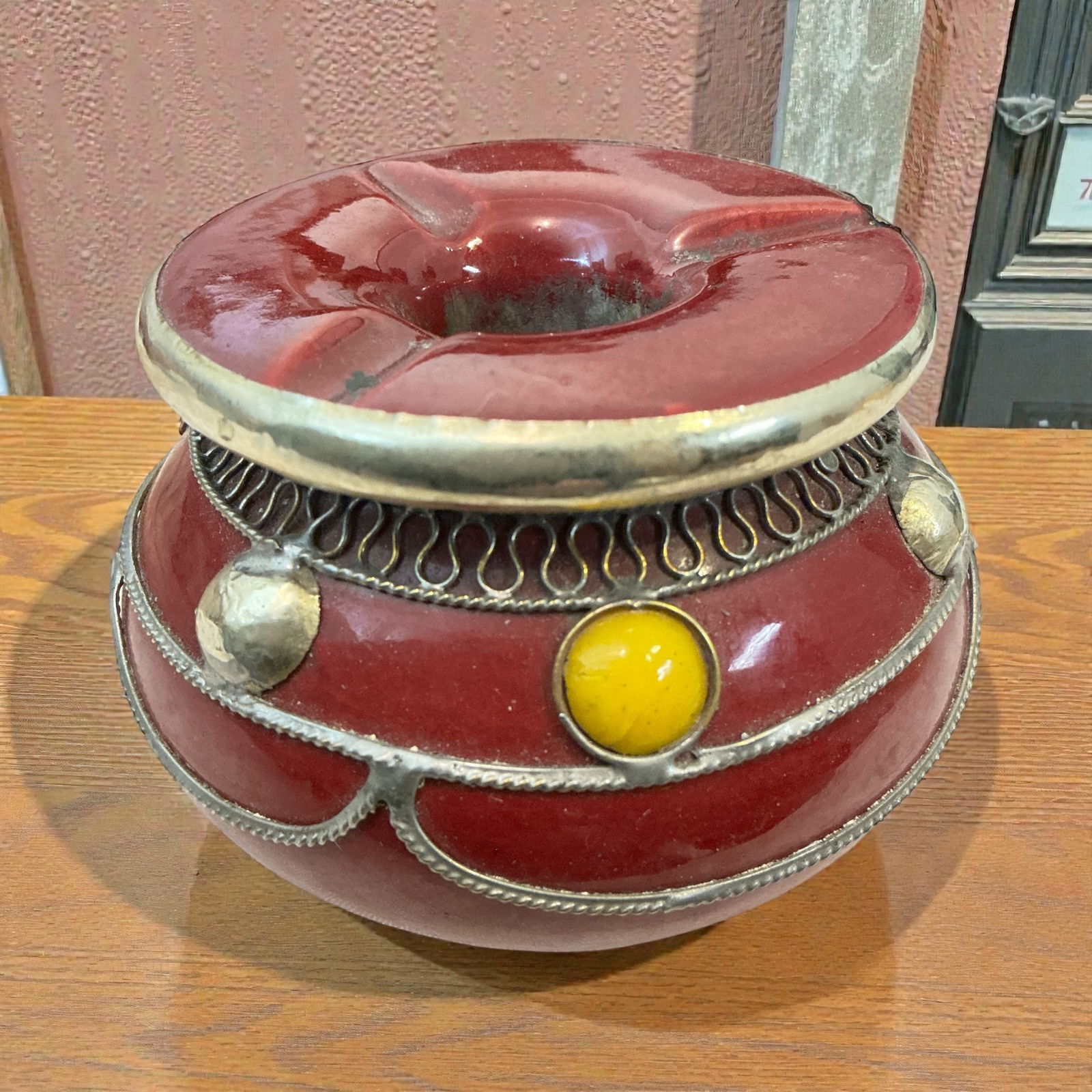 Handcrafted Moroccan ‘Smokeless’ 2-part Ashtray: Handcrafted Moroccan ‘Smokeless’ 2-part Ashtray. Distinctive red glaze with silver-toned metalwork and glass or stone applications.. Two-part design allows the top to be lifted so the ashes drop i