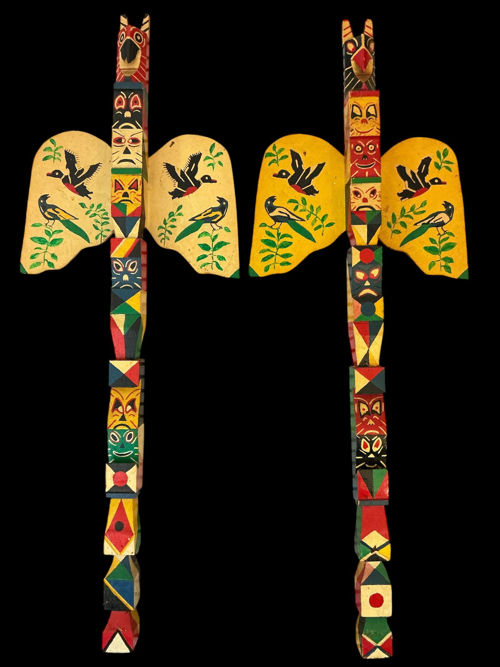 Two Handpainted Carved Wood Totems: Two Handpainted Carved WoodTotems 24” long 8”across