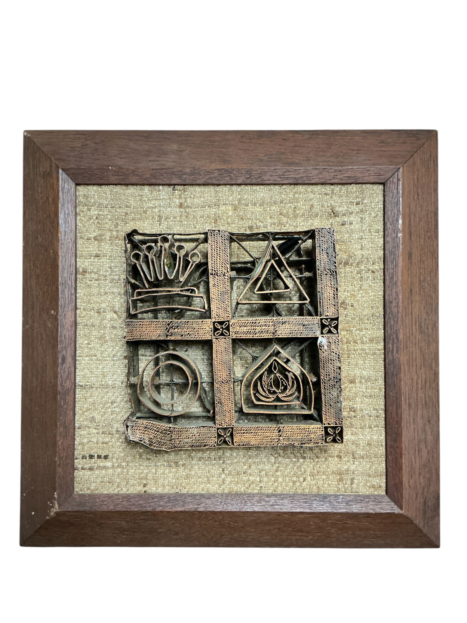 Framed Handmade Copper Batik Stamp: This is a framed traditional handmade copper batik stamp, also known as a 'tjap' or 'chap'. These unique artisan tools were historically used to stamp wax patterns onto fabric for creating intricate