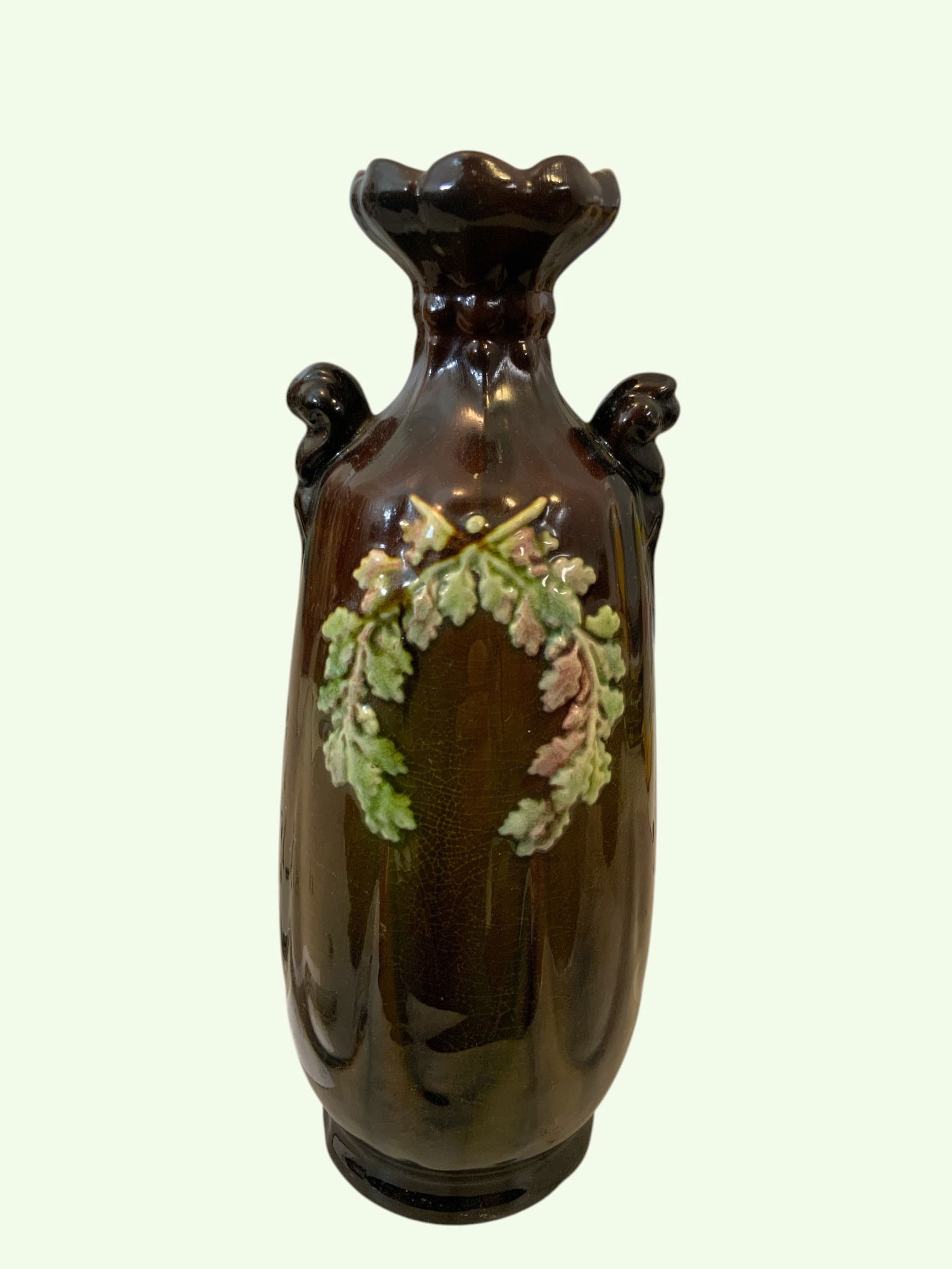 Vintage Pottery Vase Double Handle Mauve & Green Raised Sprig Wreaths: Vintage Pottery Vase Double Handle Mauve & Green Raised Sprig Wreaths. Matches a Peters and Reed of South Zanesville, Ohio Design. No chips, cracks, breaks, or repairs noted on visual inspection. Some