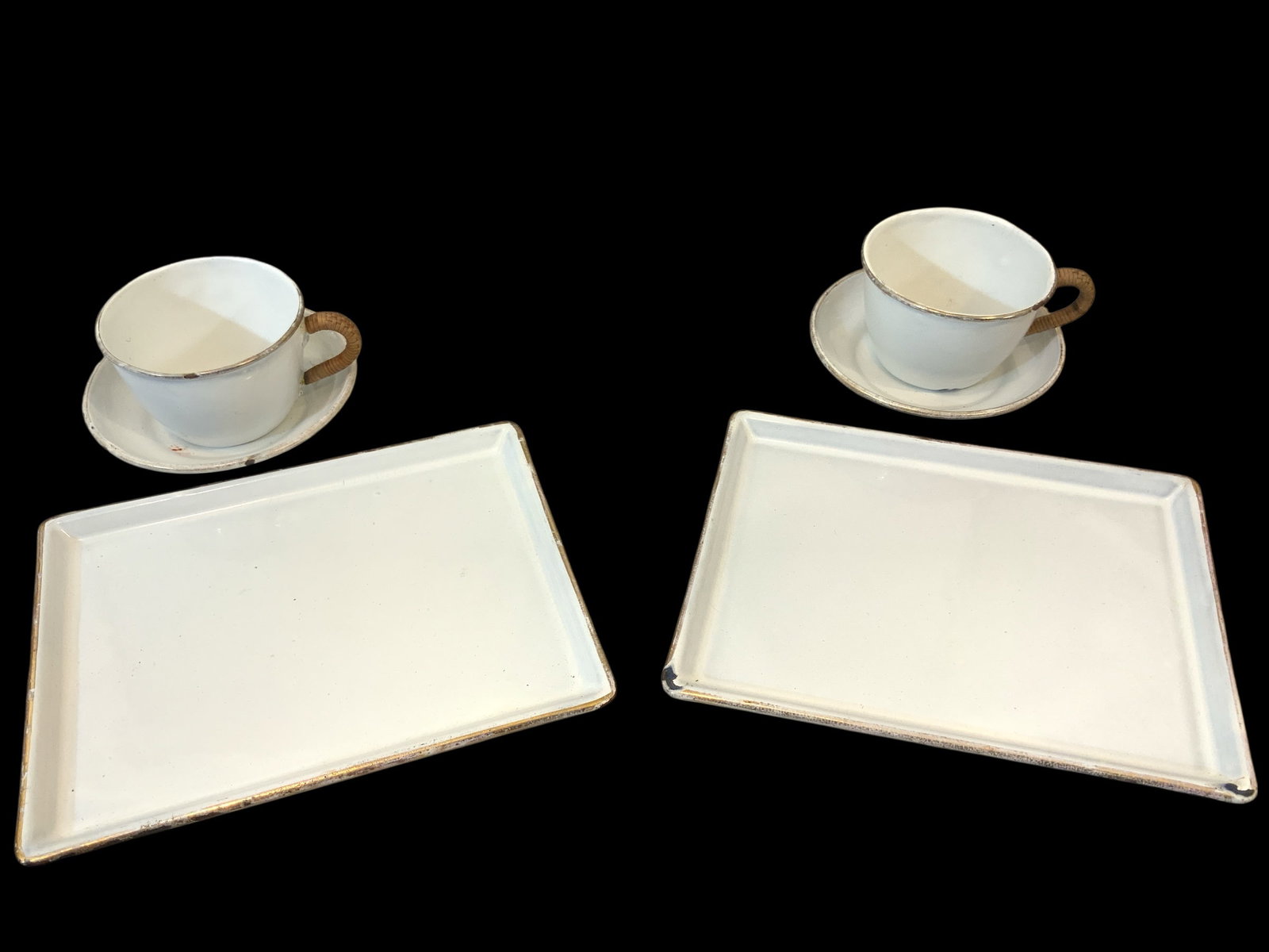 Late 19th Century Enameled Metal Cups, Saucers, Plates Gebrüder Baumann: Late 19th Century Enameled Metal Cups, Saucers, Plates Gebrüder Baumann. Cups have cane-wrapped handles. Enamel shows some wear and a few ‘dings’ but overall this set is a great example. Plates a