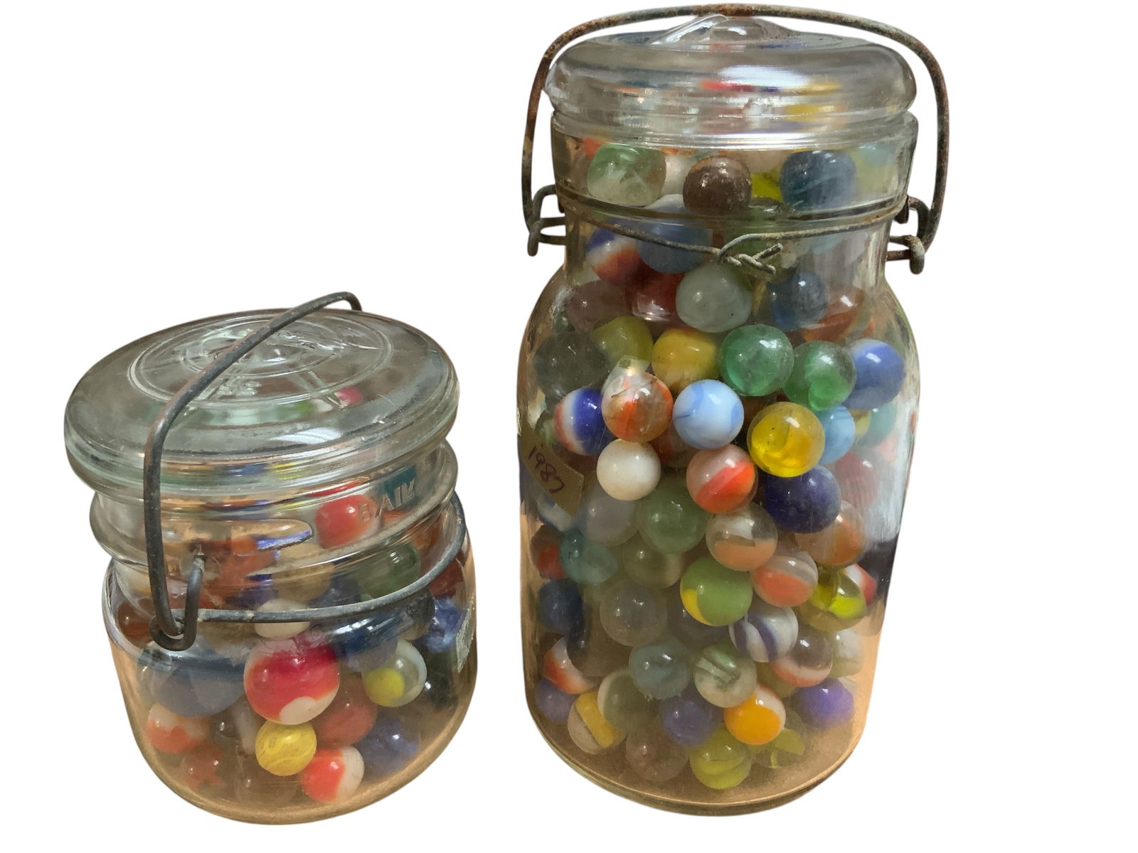2 Jars of Vintage Estate Marbles: 2 Jars of Vintage Estate Marbles. ================================= PLEASE READ =============================Shipping for this lot is available ONLY THROUGH LIVESHIPPING. We advise all bidders to obta