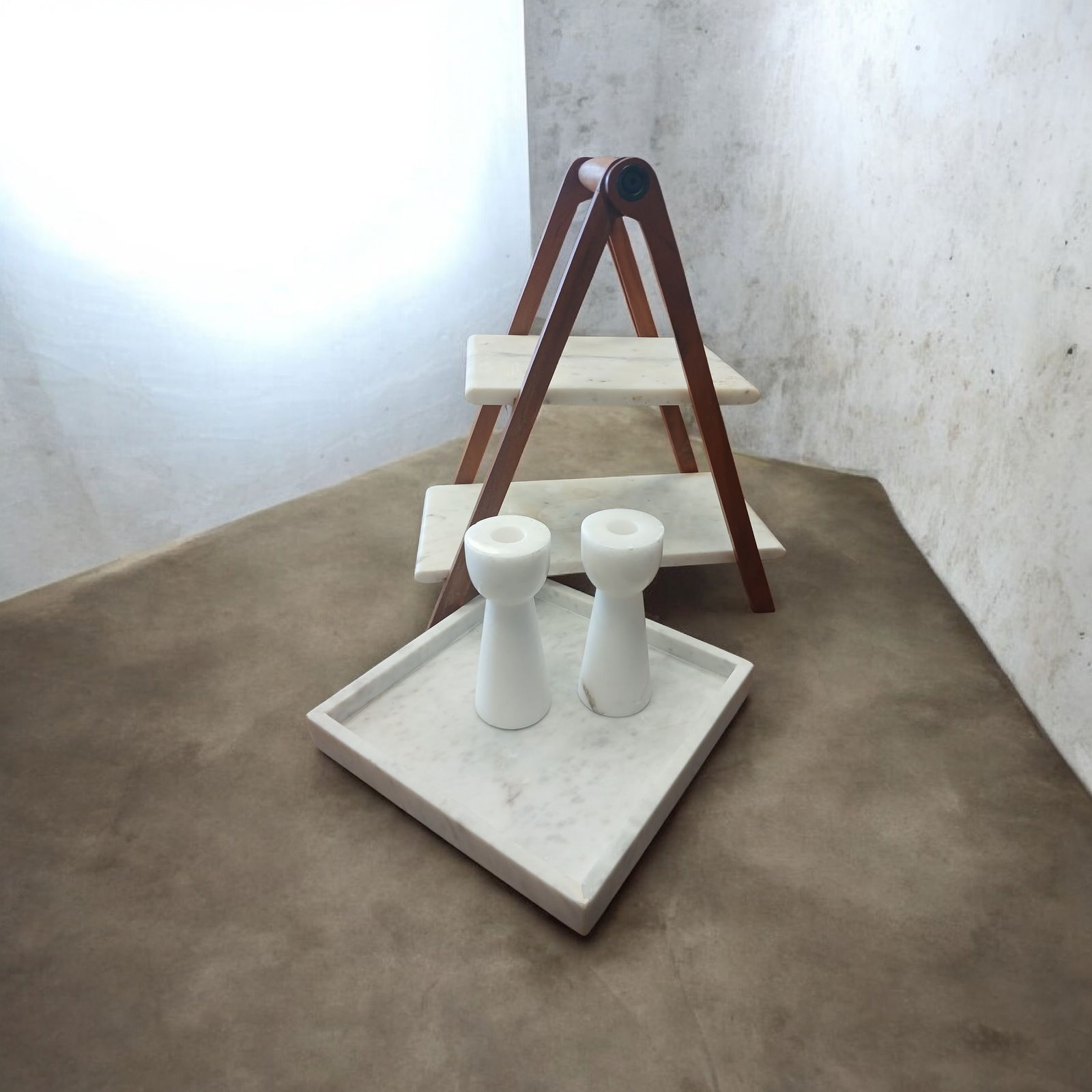 Collection of 4pc Marble Items: Collection of 4pc Marble Items Featuring pair of candle stick holders, tray, and a small two tier countertop stand. Candlesticks 6 inches tallTray is 10x10Stand is 16 inches tall and 15 inches