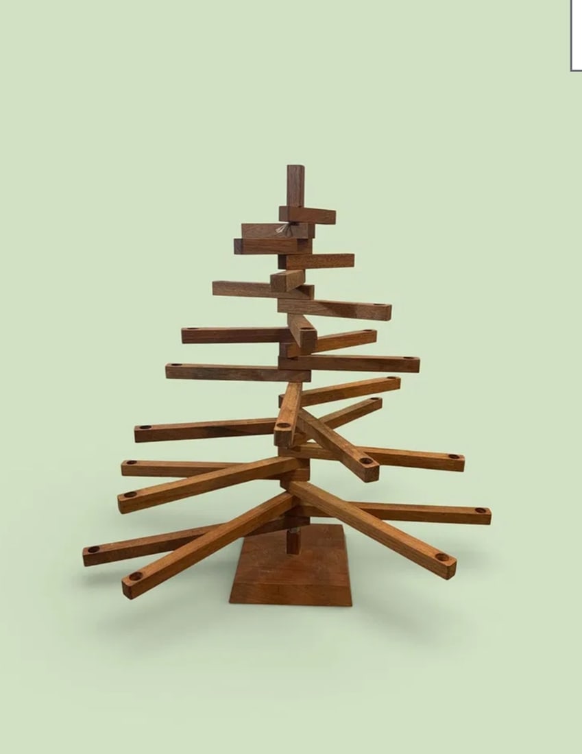 Folk art wooden candleholder: Folk Art Wooden Candleholder Customizable Christmas Tree . Each arm holds one candle at the end and can be swung into any desired position to create the effect sought after. Would make an interesting