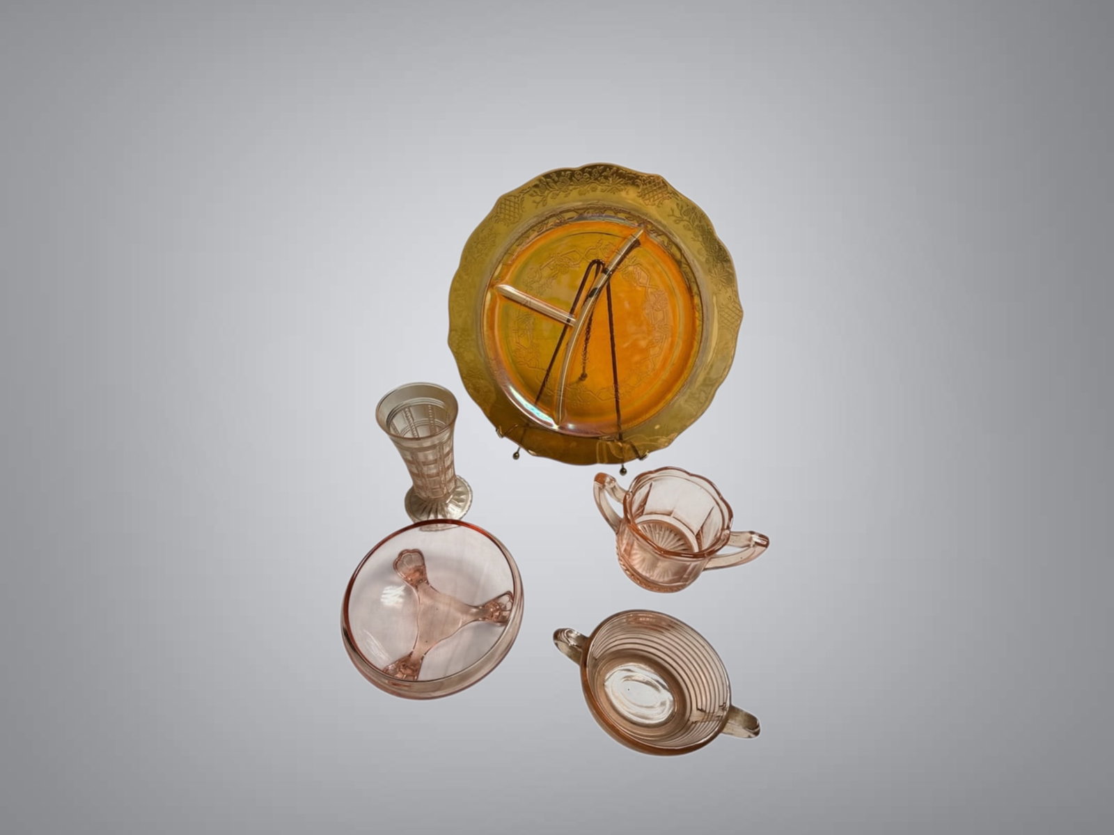 Vintage Pink Depression Glass and Irridescent Ensemble: Vintage Pink Depression Glass and Irridescent Ensemble. A great selection of Pink Depression Glass Examples! Plate is about 11” across and has a beautiful iridescence. The candy dish has a tiny