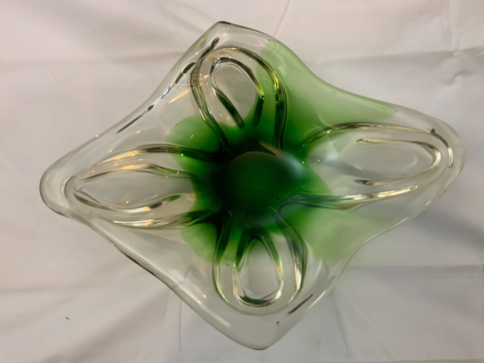 MCM Art Glass Bowl Freeform Starfish Design: MCM Art Glass Bowl Freeform Starfish Design. Green color in the base seeps upwards into the sides of the dish. Bubbles are present. Base appears to have a fracture running partially through it. Tight 