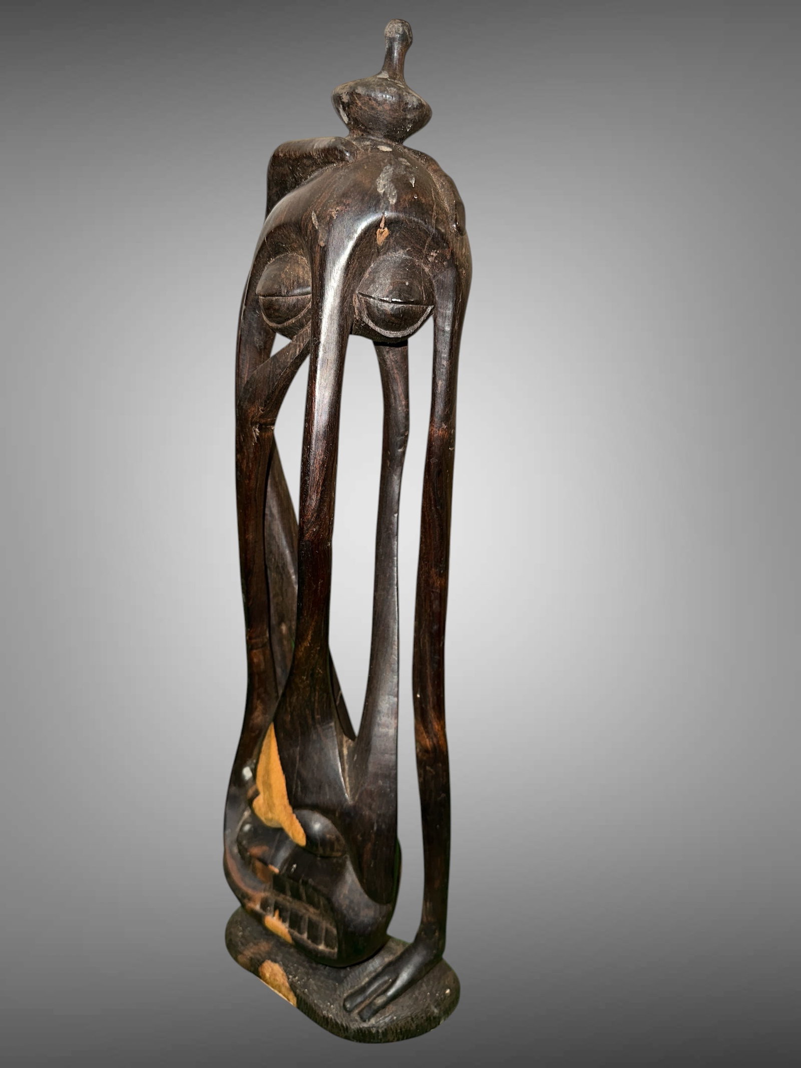 Abstract Flowing Elongated Carved Wood Spirit Sculpture: Abstract Flowing Elongated Carved Wood Spirit Sculpture. Light areas toward the base front appear to be finished differently and not missing material. Possible East Africa Origin. Attributed to Tanzan
