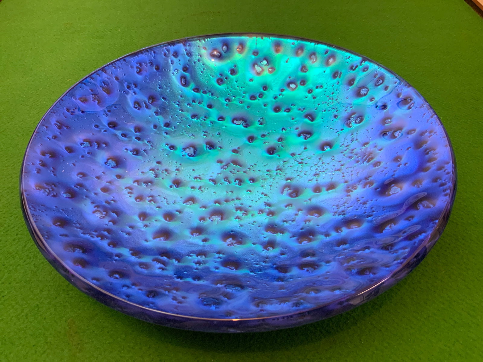 Large(15"dia) Art Glass Iridescent Blue and Turquoise Cratered Texture Bowl: Large(15"dia) Art Glass Iridescent Blue and Turquoise Cratered Bowl. No markings or labels to identify Designer or manufacturer but commonly attributed to Geoff & Patricia Caplette. 3”deep, 15&r