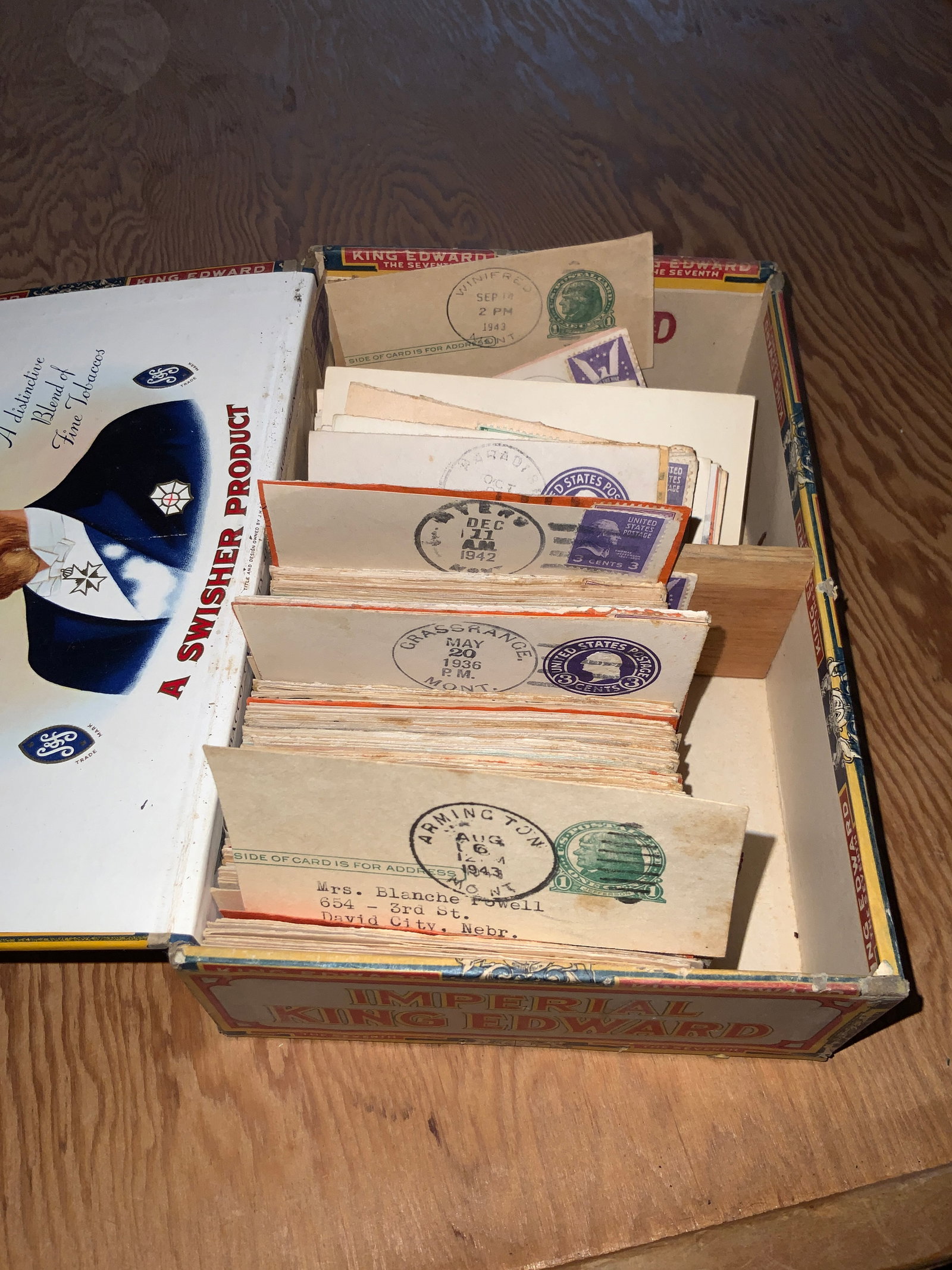 Cigar Box Containing Montana Postmarks 1930s &1940s Stamps - Alphabetized: Cigar Box Containing Montana Postmarks 1930s &1940s Stamps - Alphabetized, .Ungraded. Any marks, pencil or otherwise, are by a previous owner, not Auction Staff. Significance of any marks is unknown. 
