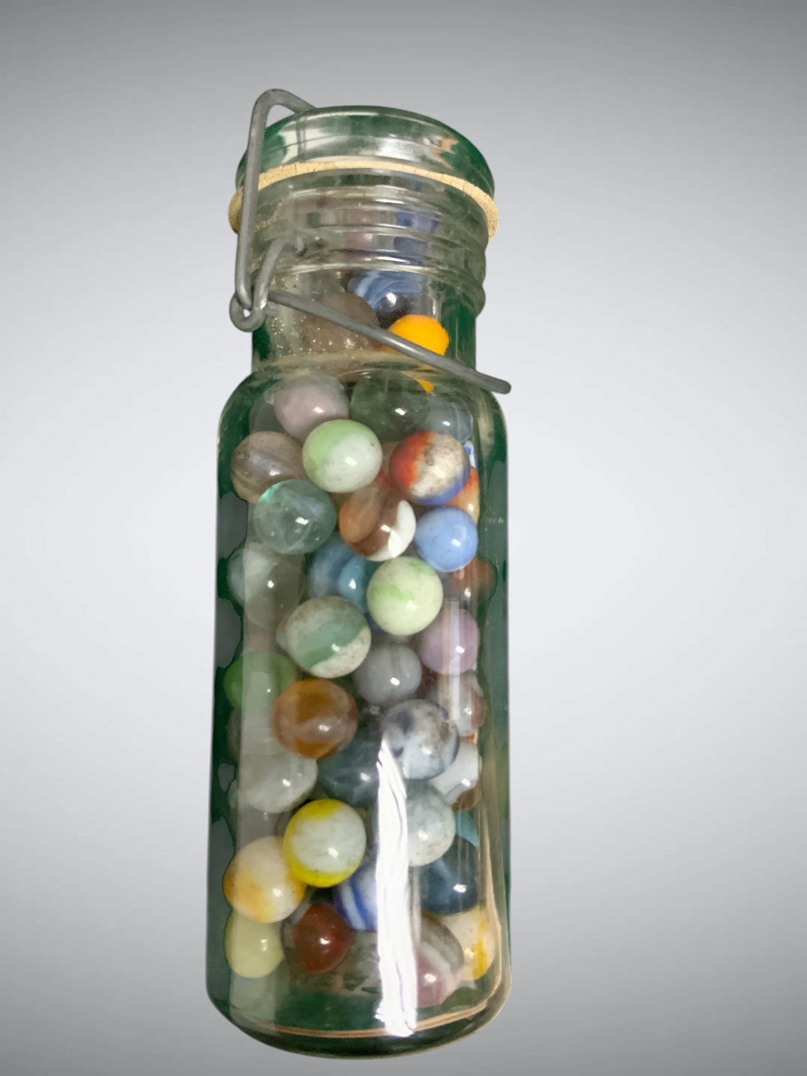 Vintage Wheaton Canning jar full of Vintage Glass Marbles: Vintage Wheaton Canning jar full of Vintage Glass Marbles. Jar is 7 1/2" tall. .>>>>>>>>>>>>>>READ—-READ—-READ—-Shipping for this lot is available ONLY THROUGH LIVEAUCTIONEERS/LIVESHIPPING. We a