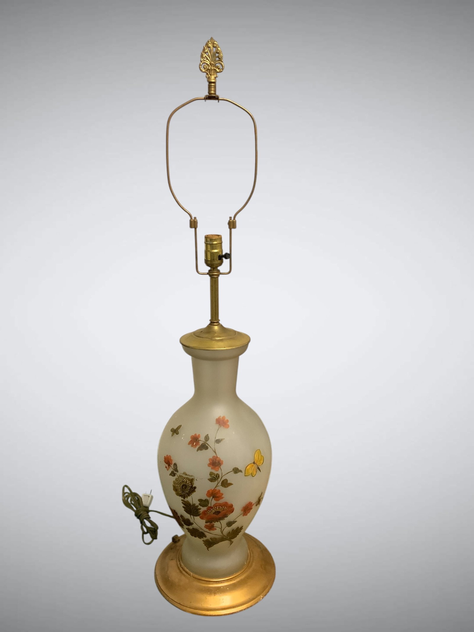 Mid-century Table Lamp with Frosted Glass Body, Brass Hardware and Wooden Base: Mid-century Table Lamp with Frosted Glass Body, Brass Hardware and Wooden Base. Handpainted floral and Butterfly decor gives this lamp a decidedly Asian flavor. Needs some cleaning. 10 1/2" diameter, 