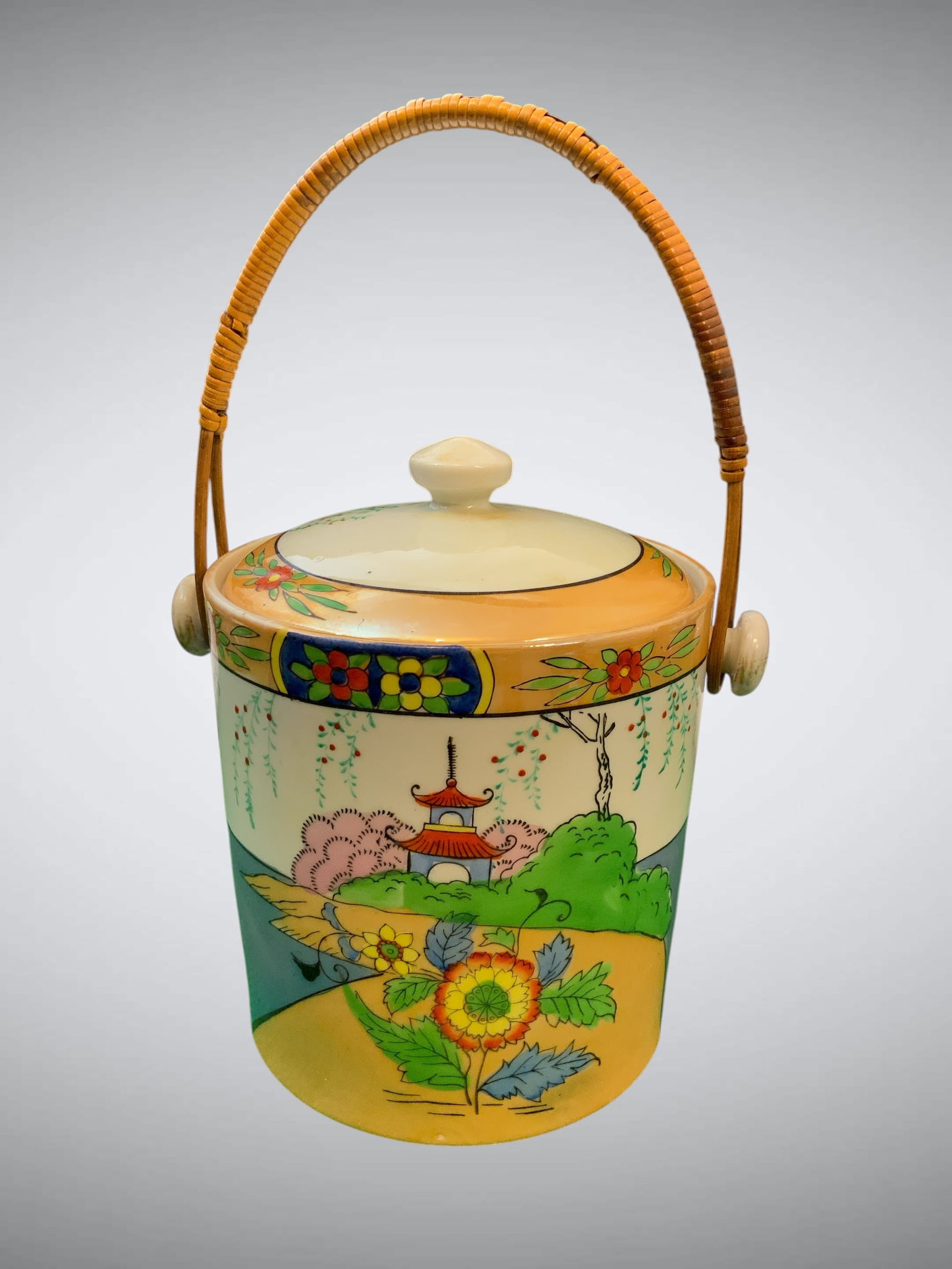 Art Deco Takito Nippon Biscuit Jar with Matching Lid: Art Deco Takito Nippon Biscuit Jar with Matching Lid. Hand-painted iridescent Lustreware Pagoda scene. Cane-wrapped handle. 8" across the handle 'knobs' and 8 1/2" tall with the lid in place. .>>>>>>>