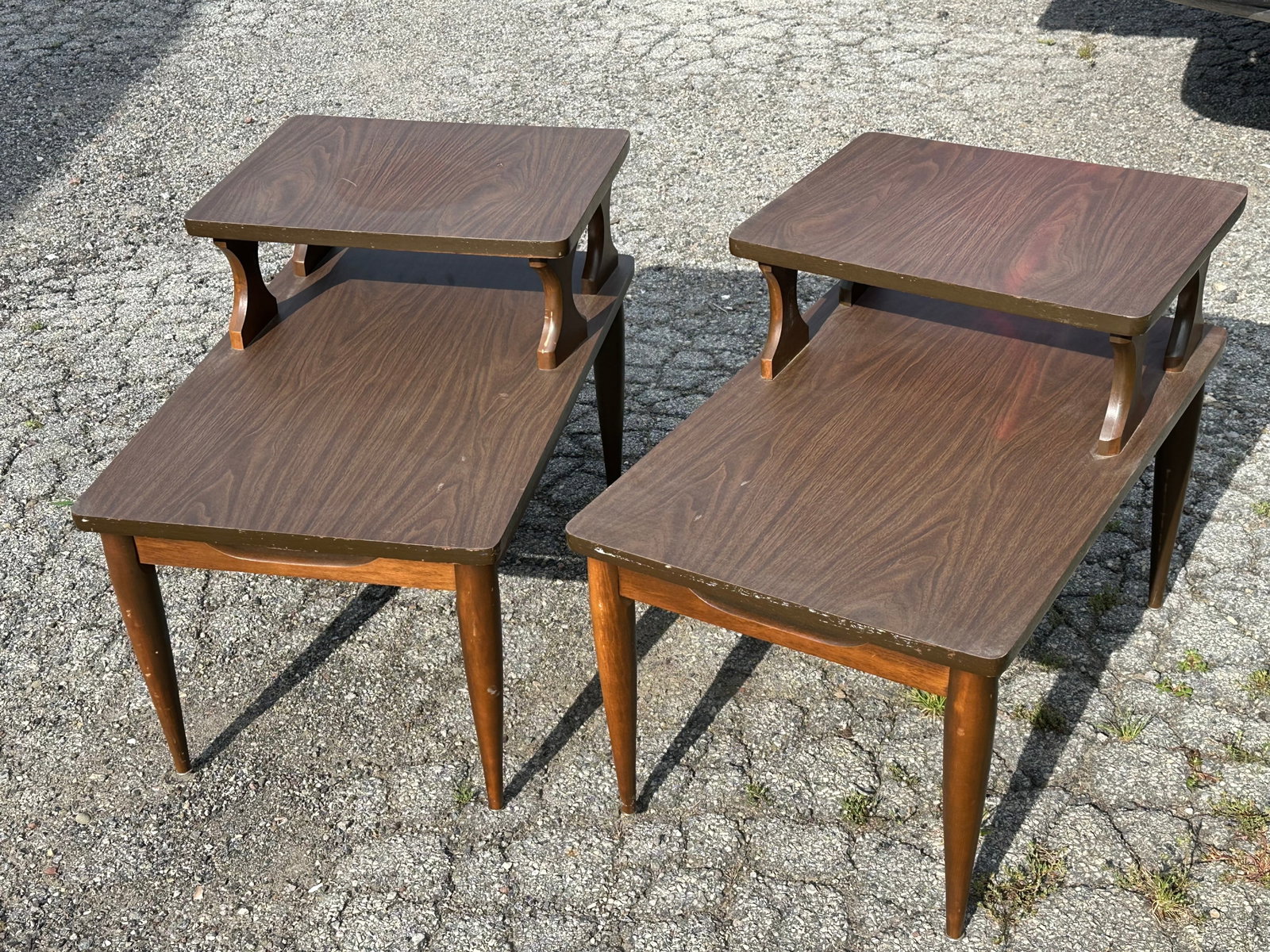 Pair Mid-Century Two-tier End Stands Laminate Top: Pair Mid-Century Two-tier End Stands Laminate Top. 22”tall x 18”wide x 28”front-to-back. .>>>>>>>>>>>>>>READ----READ----READ----Shipping for this lot is available ONLY THROUGH LIVEAU