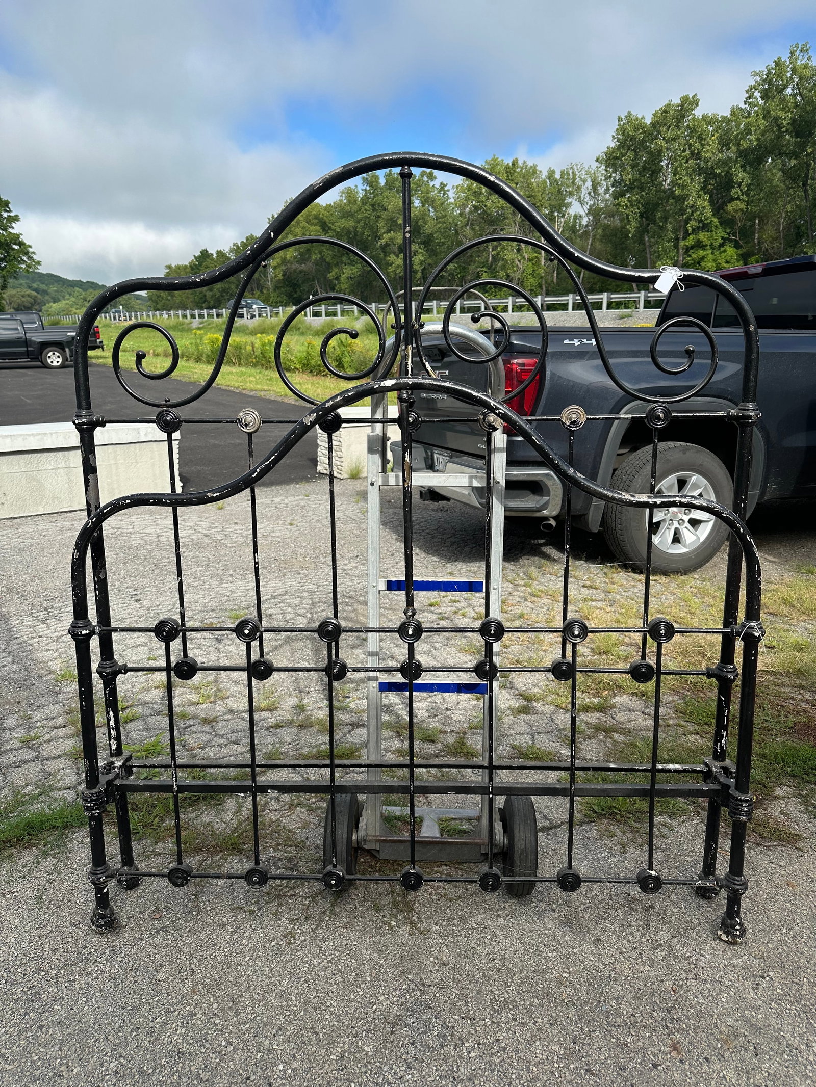 Vintage Iron Bed with Brass(?) Accoutrements: Vintage Iron Bed with Brass(?) Accoutrements. Shabby black paint. Structural frame is strongly magnetic but the decorative scrolls and such are not and appear to be brass or copper under the paint. He