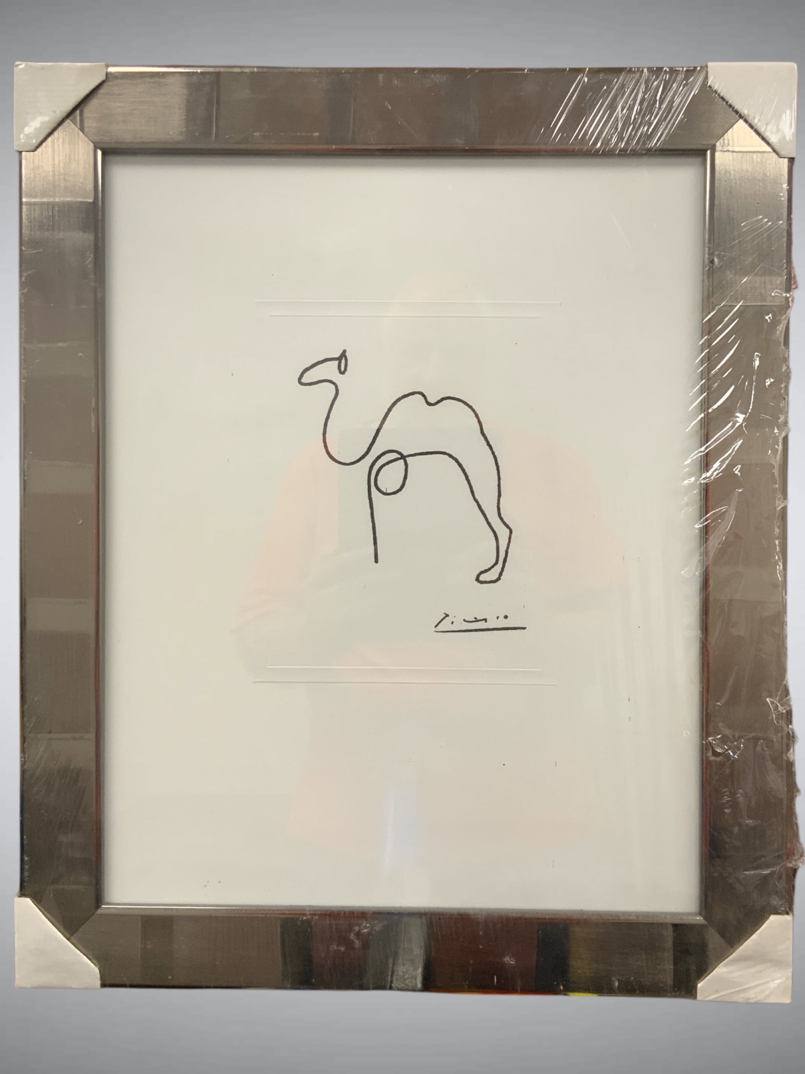 Framed Print: Pablo Picasso Continuous Line “The Camel”: Framed Print: Pablo Picasso Continuous Line “The Camel”. Still in the original cellophane wrap. Dots are shadows of marks on the cellophane. 19 1/2”wide x 23 1/2”tall. .>>>>>>>>>>>