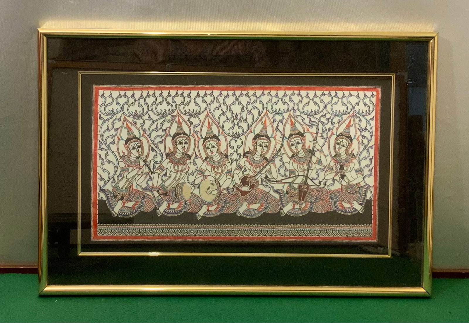 Framed Thai Handcarved Color-dyed Artwork: Framed Thai Handcarved Color-dyed Artwork. Underclass but the 3D nature of the piece can be seen by shining light in changing directions and observing the movement of shadows. Appears to be cut from h