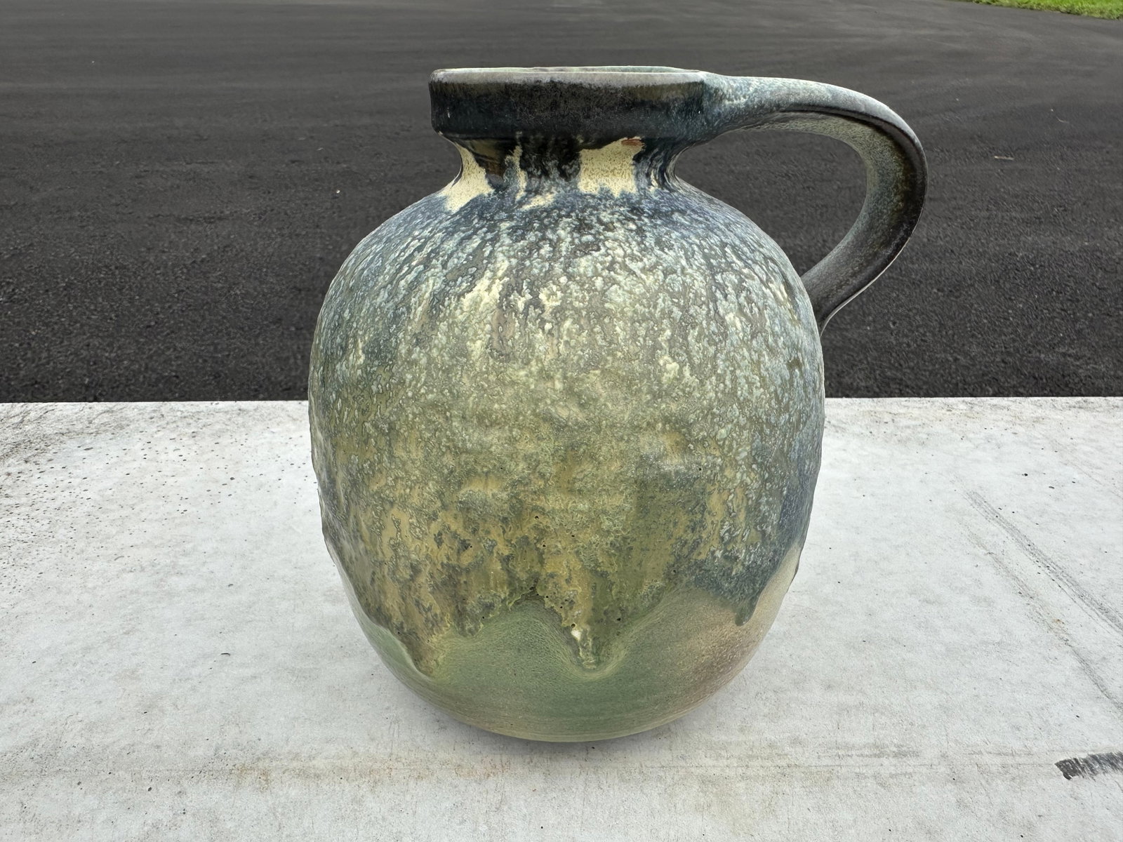 Earthy Drip Glaze Pottery Jug Venezuela: Earthy Drip Glaze Pottery Jug Venezuela. Provenance on the bottom. 8 1/2”tall x 6 1/2”diameter.. .>>>>>>>>>>>>>>READ—-READ—-READ—-Shipping for this lot is available ONLY THROUGH LIVE