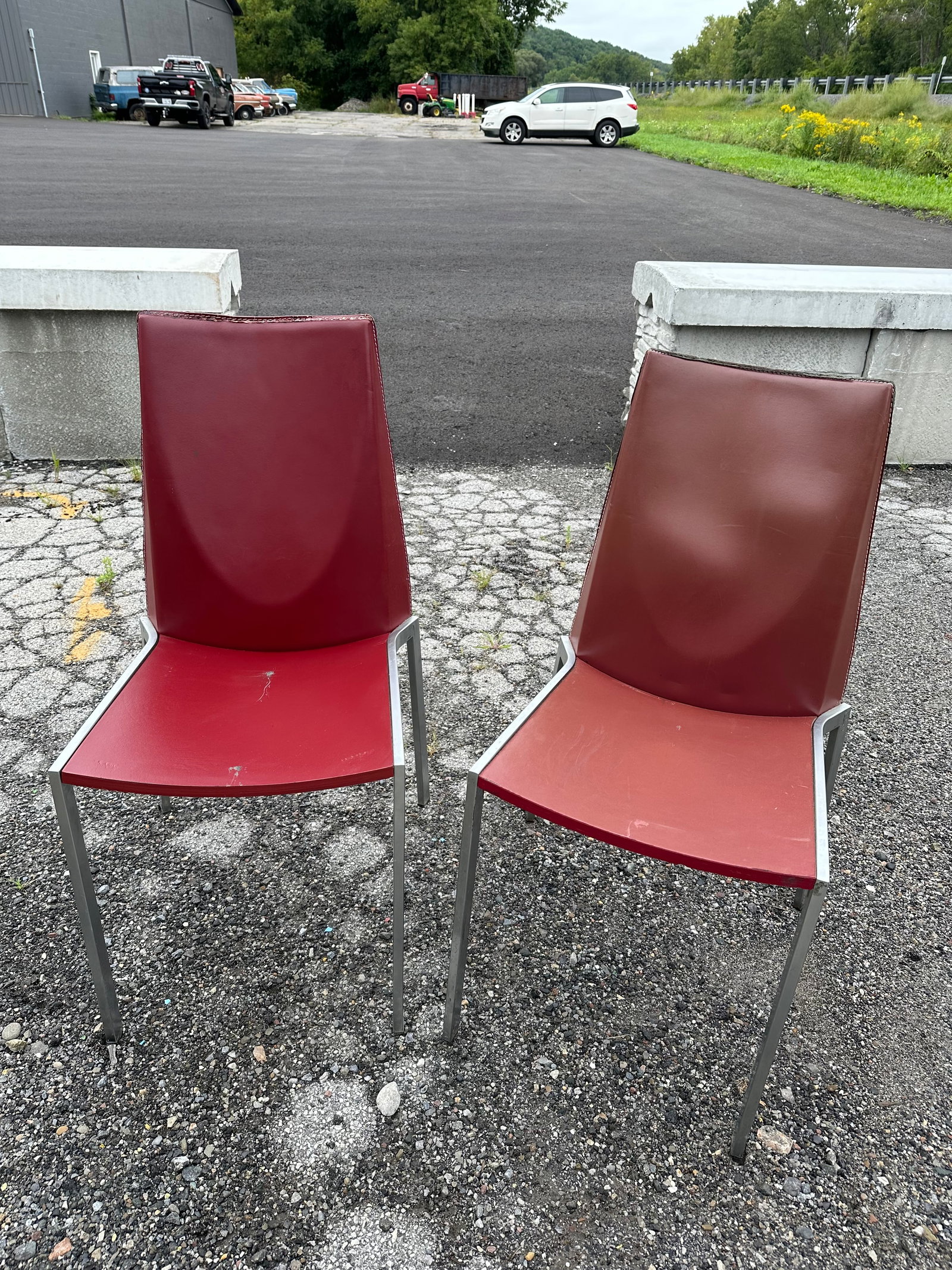 (2) Italian PostModern High Back Side Dining Chairs: (2) Italian PostModern High Back Side Dining Chairs. Marked 'MADE IN ITALY'. Covers have marks and etc. as shown. One is deep red and the other is more brown. 37"tall x 19"wide x 19 1/2"front-to-back.