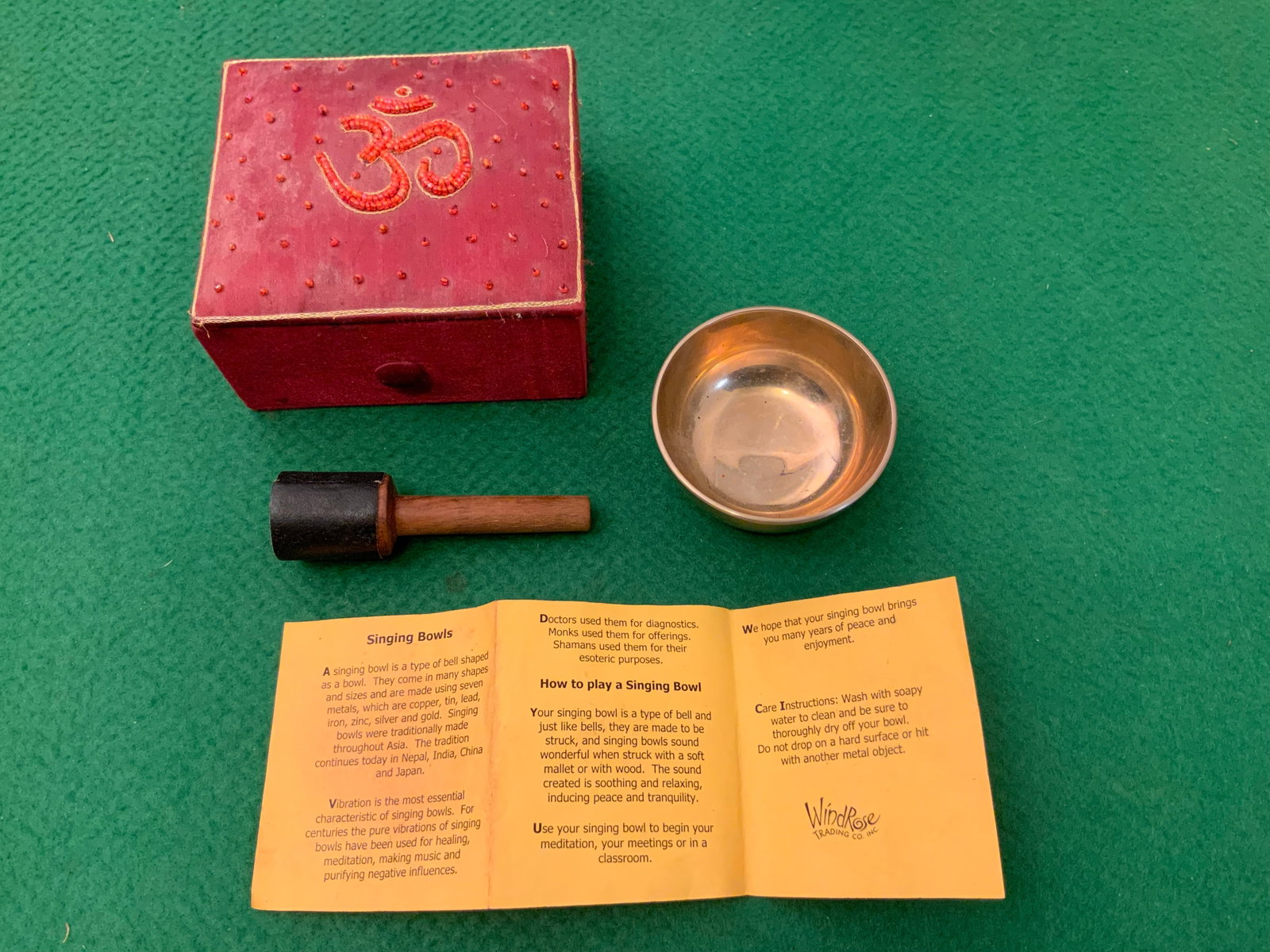 Asian SINGING BOWL Set by Wind Rose Trading Company: GET A SHIPPING QUOTE BEFORE YOU BID. .Asian SINGING BOWL Set by Wind Rose Trading Company. Seven-metal alloy composition to produce a particular vibrational quality when struck. A type of bell in a bo