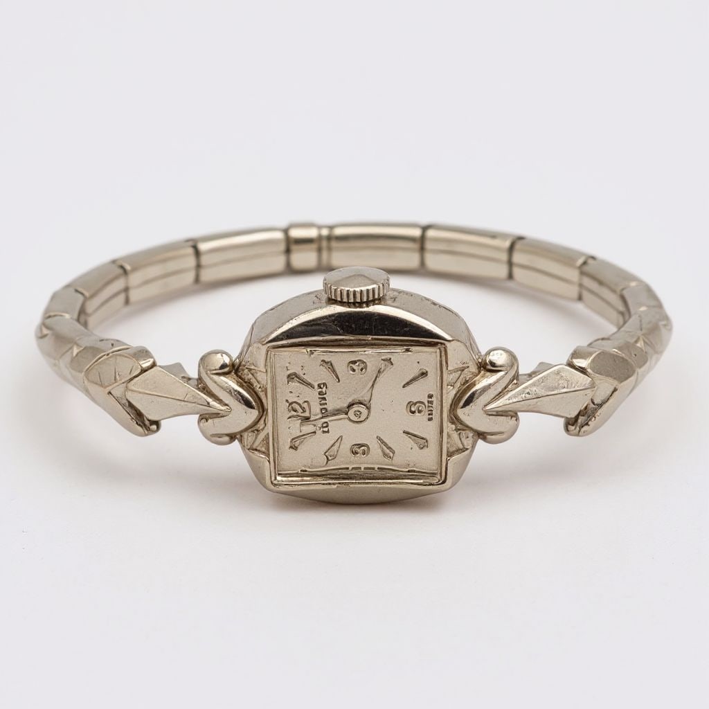 Longines Ladies Wrist Watch In 14K White Gold Swiss Mechanical Movement Band Material Stainless: Longines Ladies Wrist Watch In 14K White Gold Swiss Mechanical Movement Band Material Stainless Steel - Watch is marked 14K on the back of the watch. It is tested and works. Watch is not automatic win