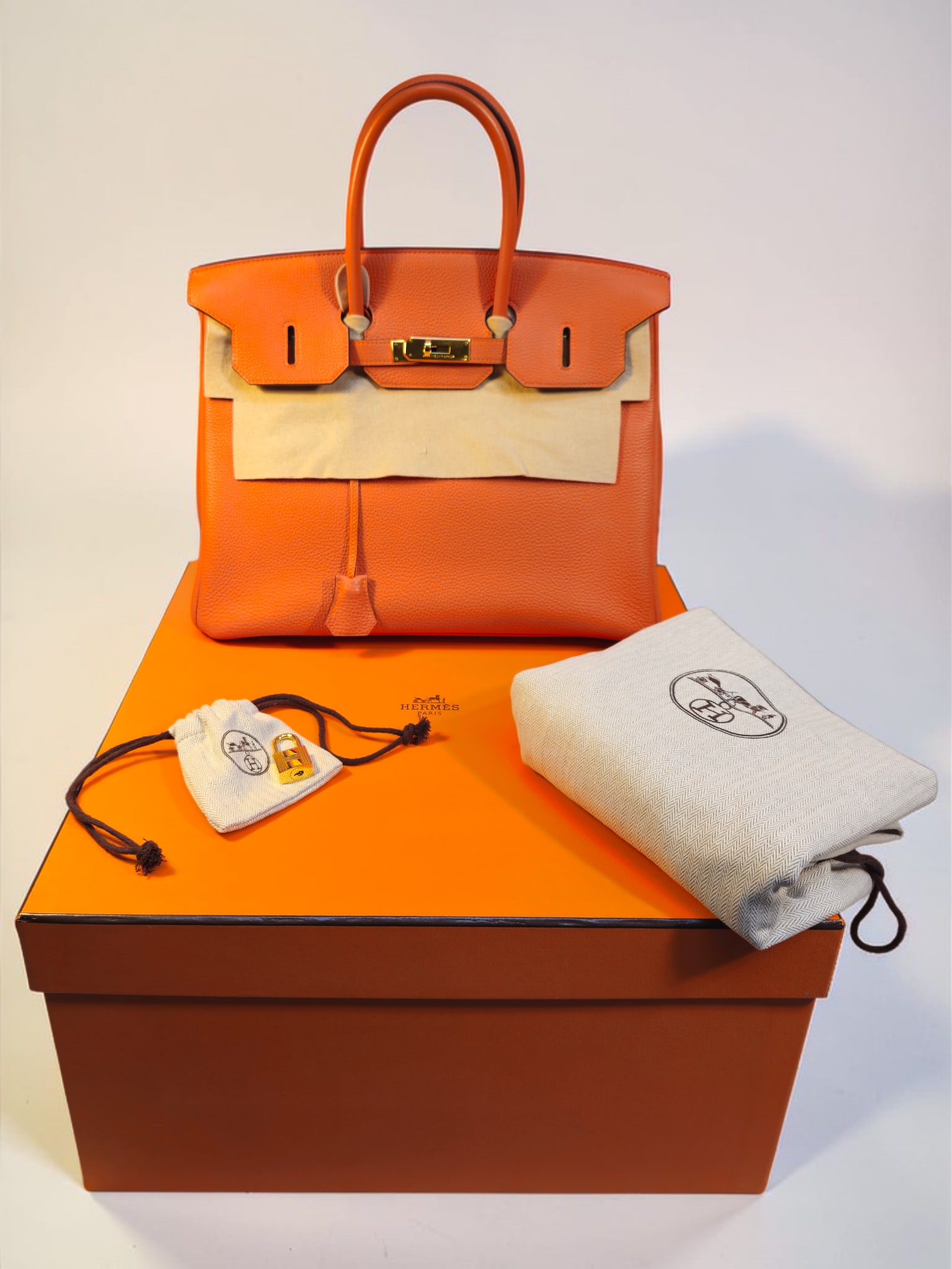 Highly Collectible Authentic Hermès Birkin 45 (HAC 45) in Orange leather with Gold Hardware: Highly Collectible Authentic Hermès Birkin 45 (HAC 45) in Orange leather with Gold Hardware, produced in 2010 (N Square Stamp) during the iconic Jean Paul Gaultier era.Hand stitched in France by a si