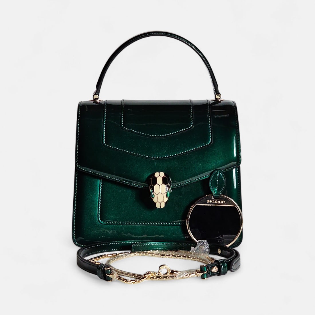New Authentic Bvlgari Serpenti Forever Top Handle Shoulder Bag Shiny Emerald Green Karung Leather: Brand New Authentic Bvlgari Serpenti Forever Top Handle Shoulder Bag in Shiny Emerald Green Karung Leather Iconic Snakehead Closure Featuring Black and White Enamel With Green Malchite Eyes - Serial N