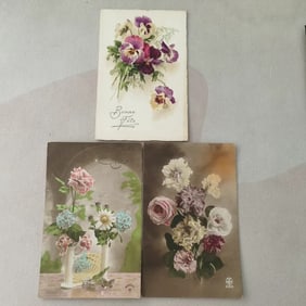 A set of French floral-themed holiday postcards from the late 19th century