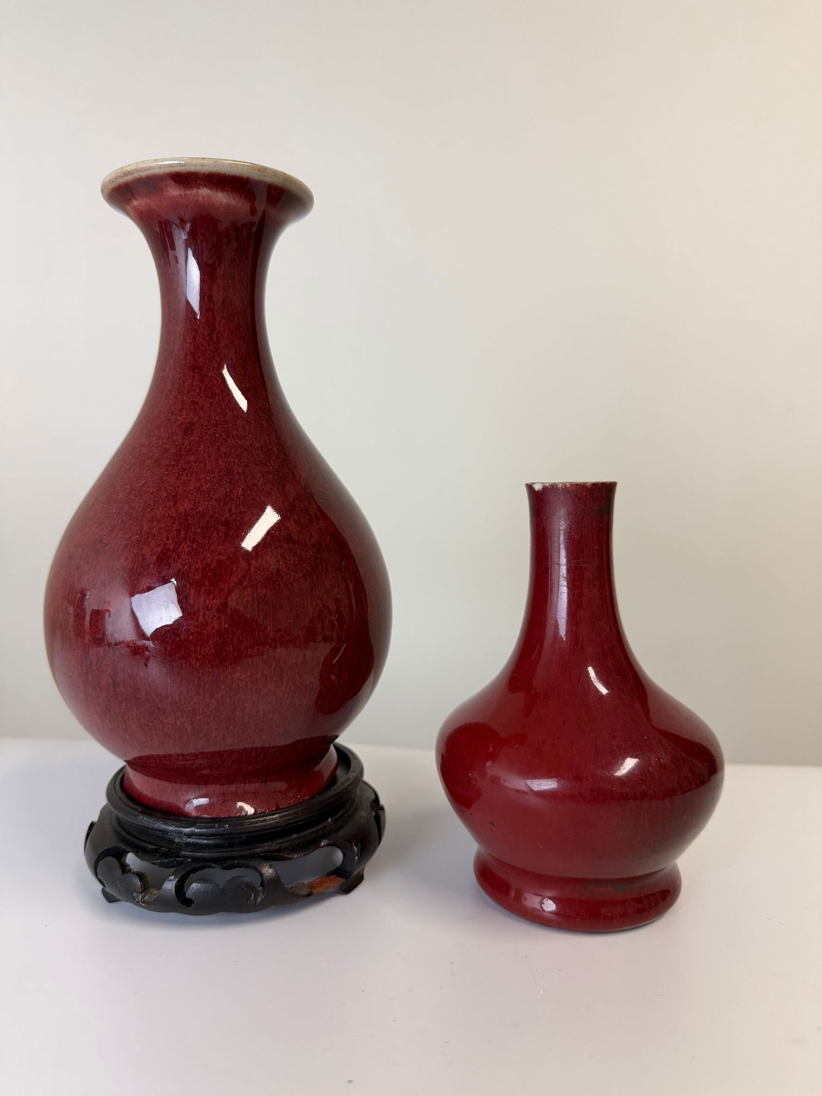 Set of 2 Chinese oxblood red glazed porcelain vases: Dimension: 5.6-8.1 inch / 14.2-20.2 cm , please note Due to manual measurement, dimensions may vary. Condition: Good used condition, please note buyers are obligated to come to the site to inspect