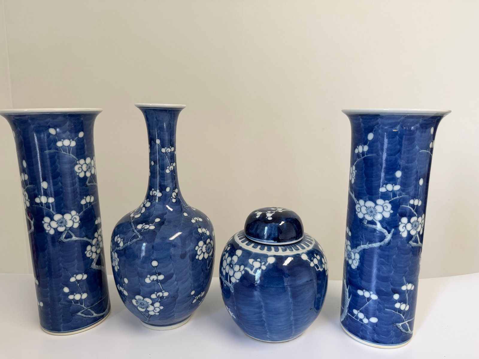 Set of 4 Chinese blue and white plum bossom porcelain China vases: Dimension: the jar tall 5.7 inches/ 14.5 cm and the tall vases tall 10.3 inches/ 26.2cm. , please note Due to manual measurement, dimensions may vary. Condition: Good used condition, please note buyer