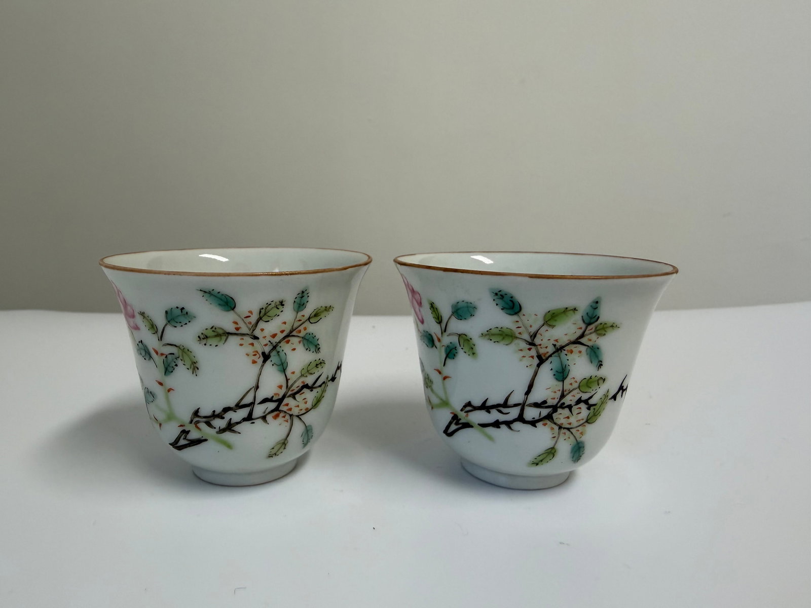 Pair of Chinese Enameled famille rose flowers porcelain China cups: Dimension: 2.4 inches/ 5.9 cm. , please note Due to manual measurement, dimensions may vary. Condition: Good used condition, please note buyers are obligated to come to the site to inspect the conditi