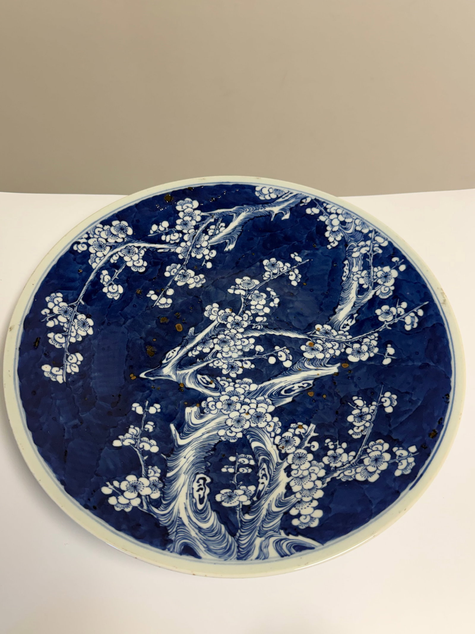 Large Chinese blue and white plum bossom porcelain China plate: Dimension: width 13.4 inches/ 34 cm. , please note Due to manual measurement, dimensions may vary. Condition: Good used condition, please note buyers are obligated to come to the site to inspect the c