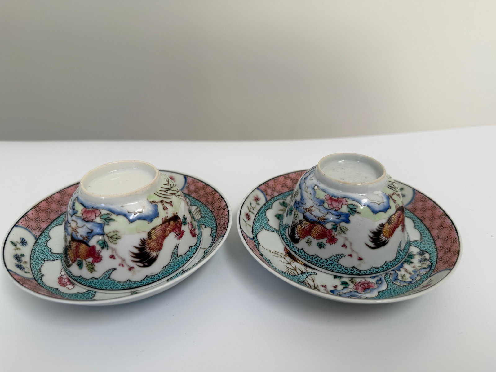 Pair Of Chinese Enameled famille rose porcelain China saucers and cups: Dimension: the cups' width 2.6 inches/ 6.6 cm and the saucers' width 4.2 inches/ 10.6 cm, please note Due to manual measurement, dimensions may vary. Condition: Good used condition, please note buyers
