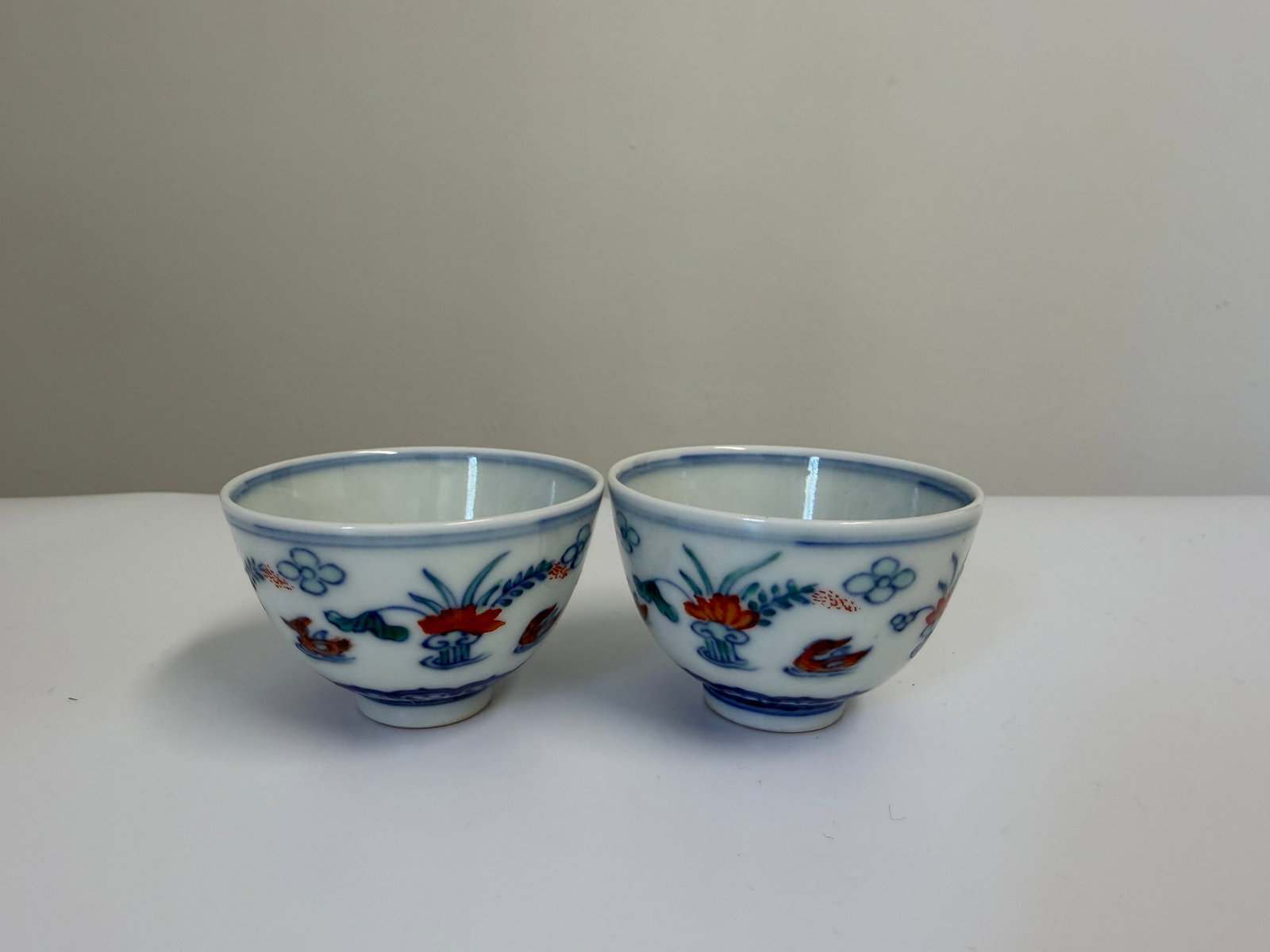 Pair of Chinese Enameled famille rose blue and white Teals porcelain China cups: Dimension: the item's width 2.2 inches/ 5.5 cm, please note Due to manual measurement, dimensions may vary. Condition: Good used condition, please note buyers are obligated to come to the site to insp