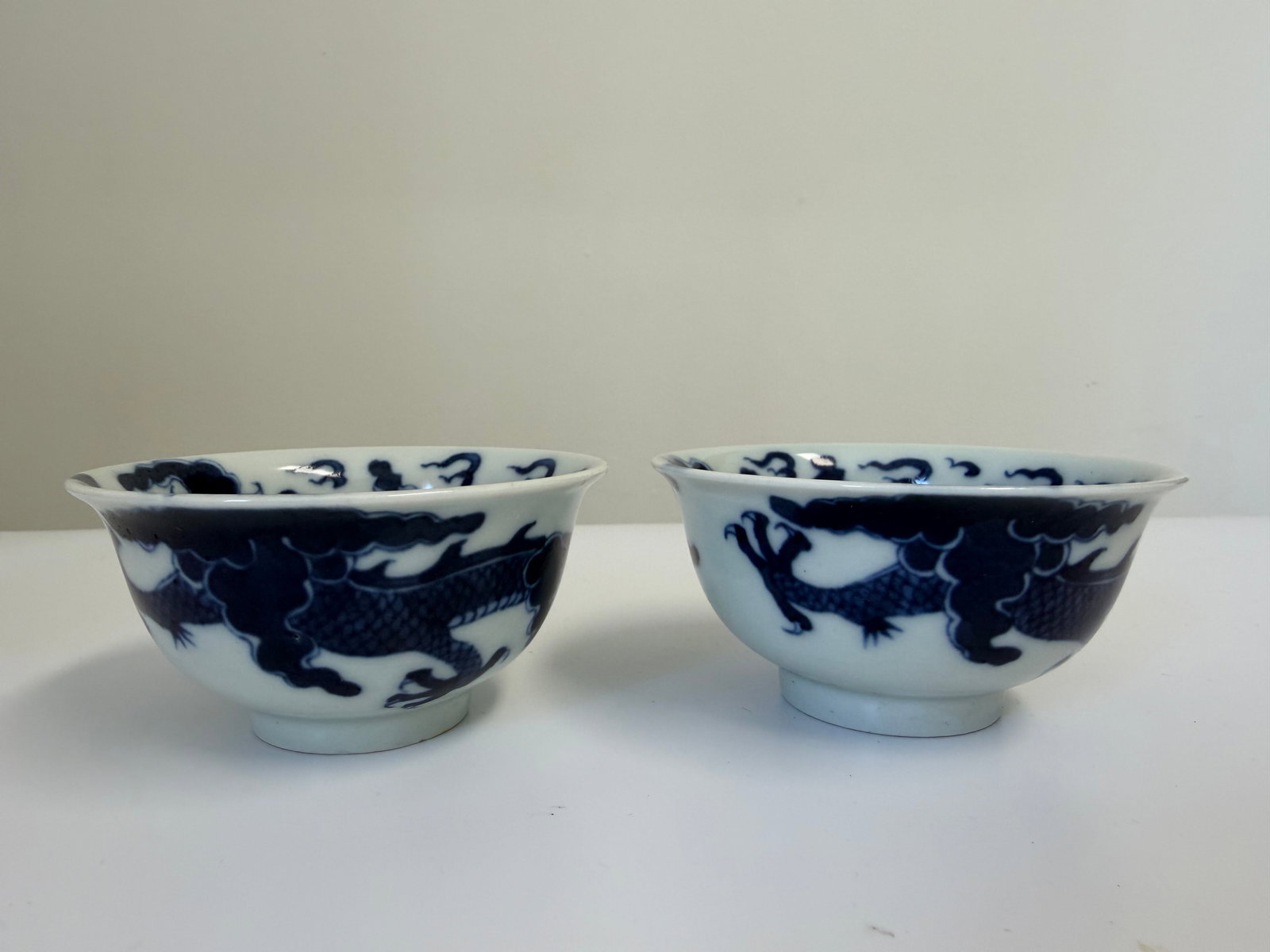 Pair of Chinese blue and white dragons porcelain China bowls: Dimension: the item's width 3.6 inches/ 9 cm, please note Due to manual measurement, dimensions may vary. Condition: Good used condition, please note buyers are obligated to come to the site to inspec