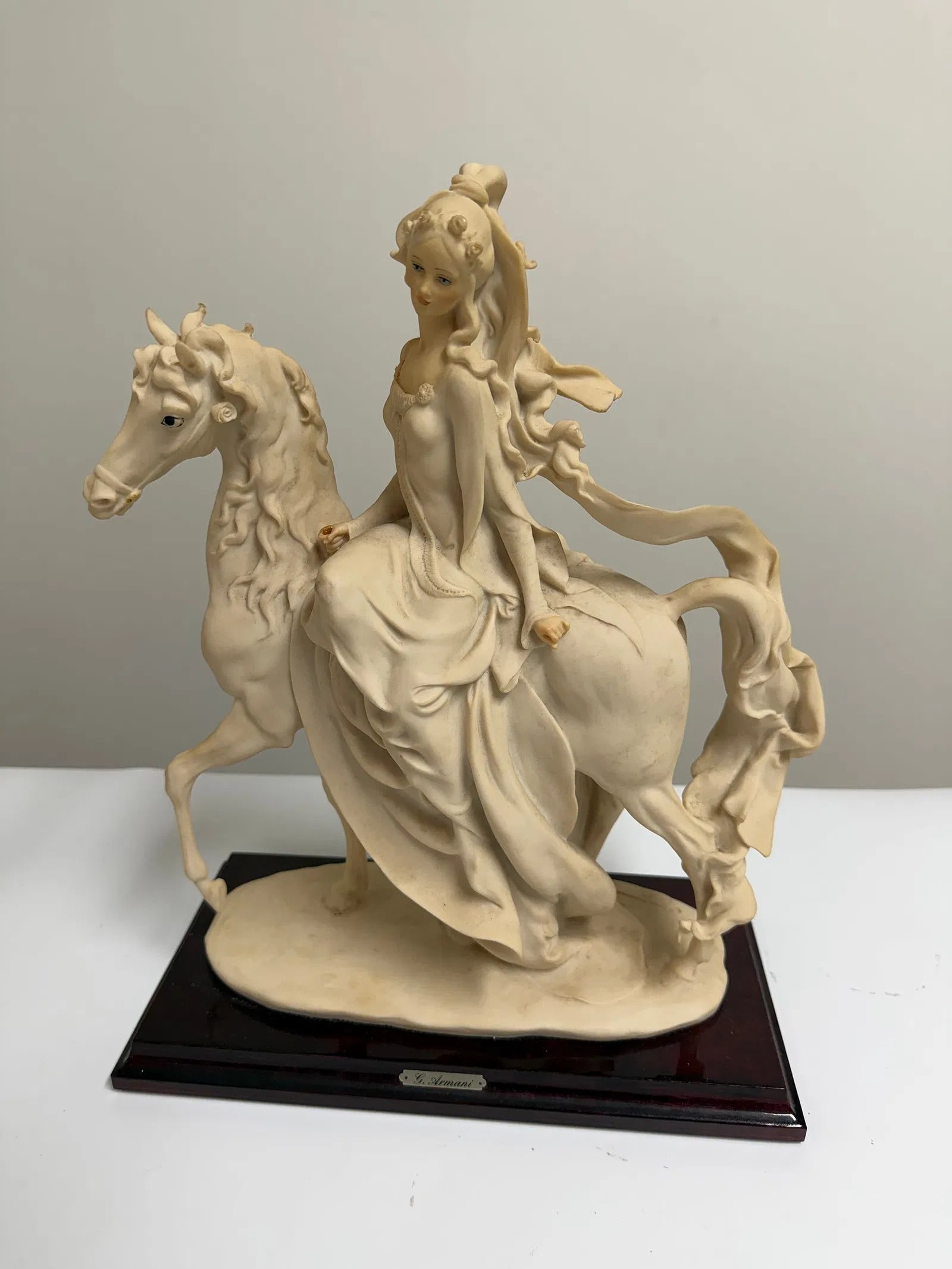 Vintage equestrian lady figurine on wooden base: Dimension: The bigger one tall 15 inch / 38.1 cm , please note Due to manual measurement, dimensions may vary. Condition: Good used condition, please note buyers are obligated to come to the site to i