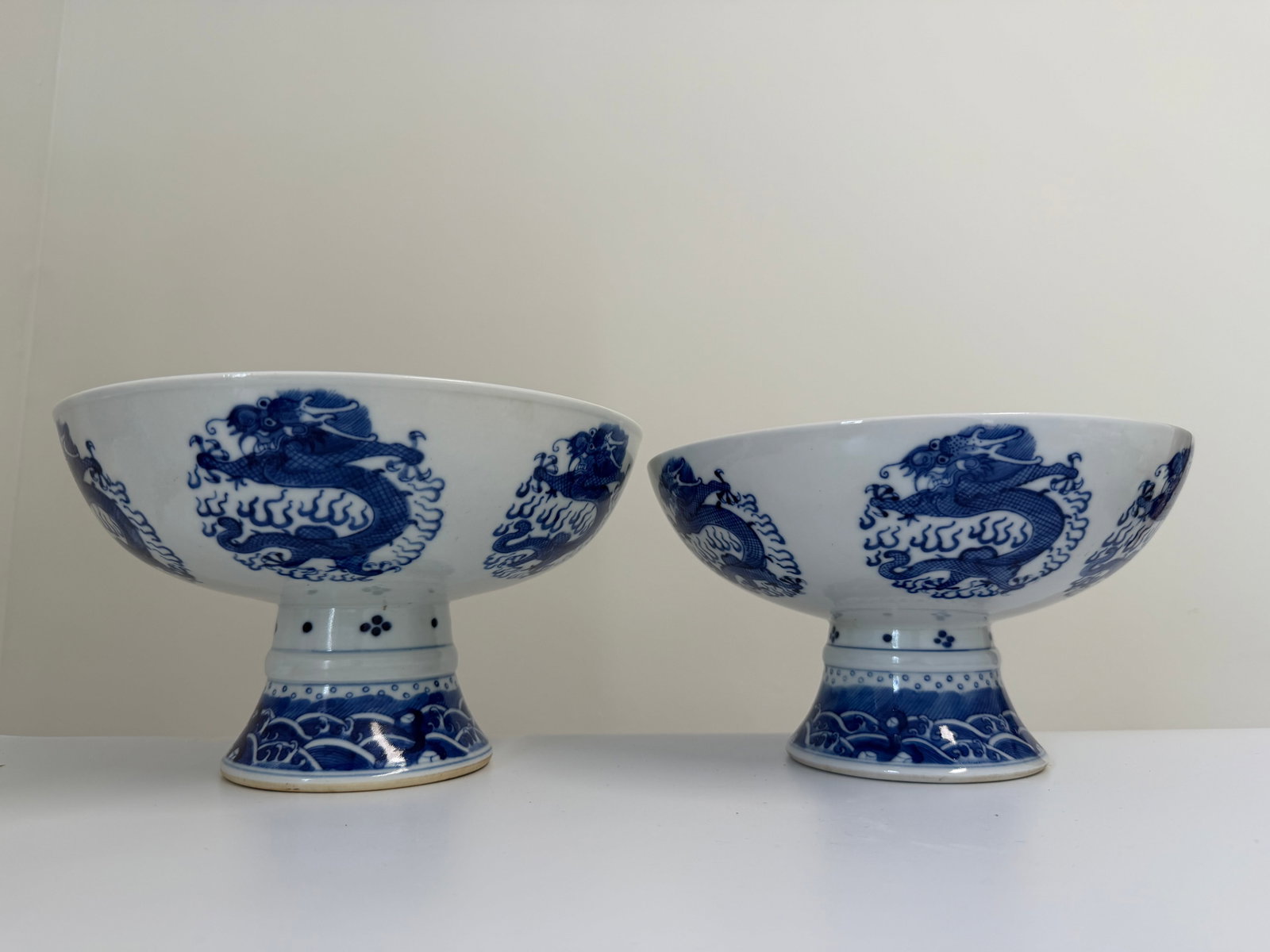 Set of 2 Chinese blue and white dragons foot bowls: Dimension: 8.6 inch, please note Due to manual measurement, dimensions may vary. Condition: Good used condition, please note buyers are obligated to come to the site to inspect the condition and detai