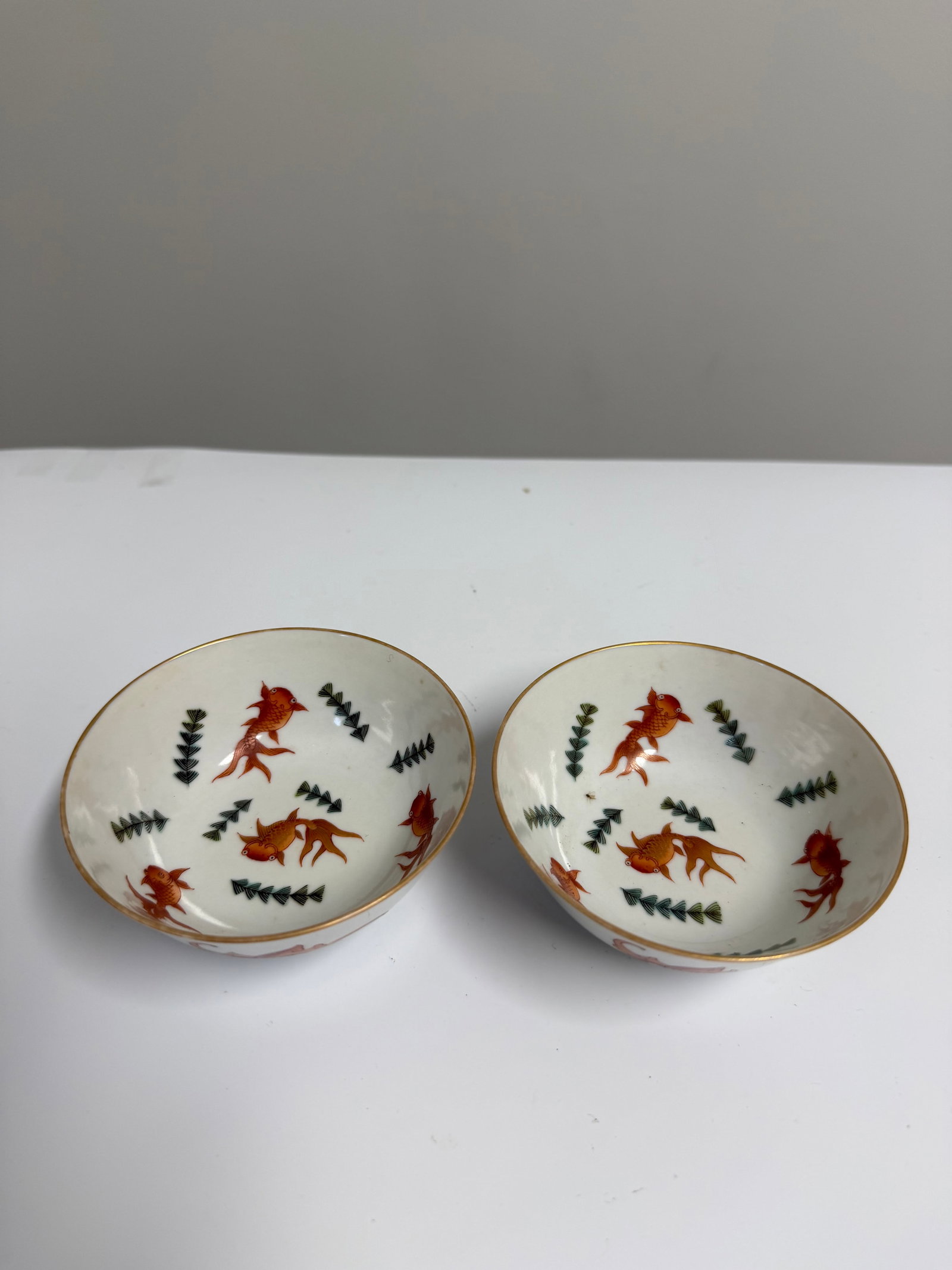 Pair of Chinese Enameled famille rose gilded fish porcelain China bowls mark: Dimension: 3.6 inch, please note Due to manual measurement, dimensions may vary. , please note buyers are obligated to come to the site to inspect the condition and details of the item. condition