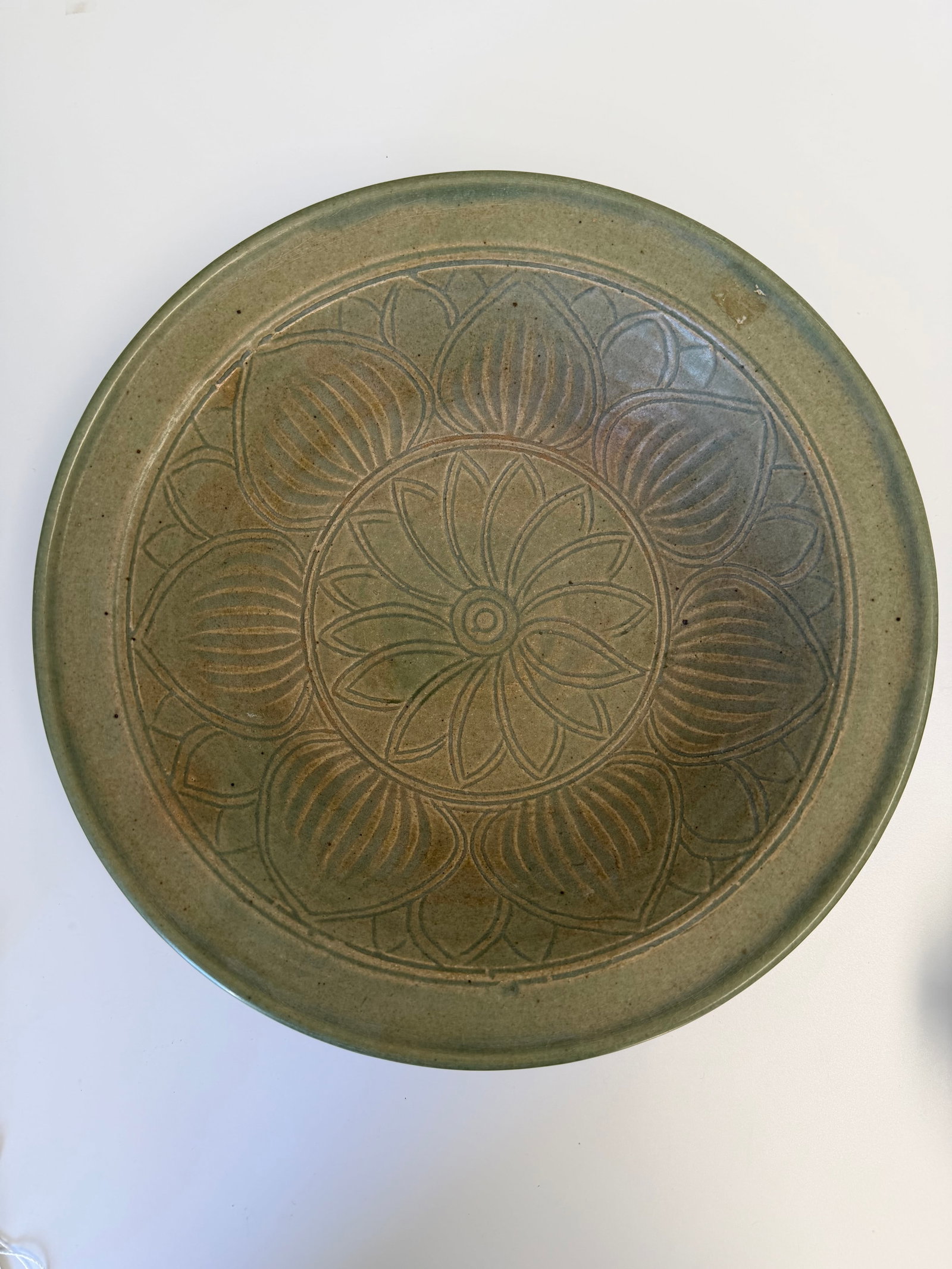 Chinese Yaozhou Kiln Song style carved lotus plate: Dimension: 11 inch, please note Due to manual measurement, dimensions may vary. , please note buyers are obligated to come to the site to inspect the condition and details of the item. condition repor
