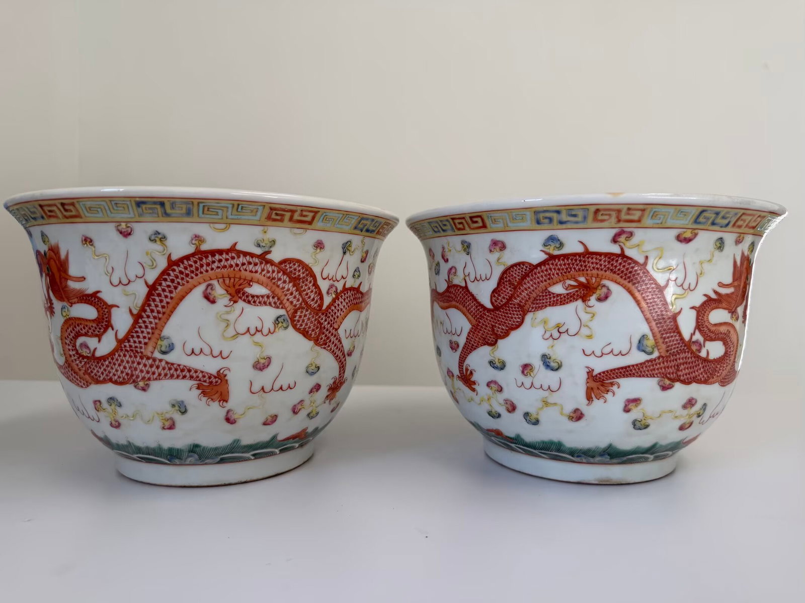 Pair of Chinese enamel famille rose dragon and Phoenix porcelain flowerpots: Dimension: 8.2x5.4 inches , please note Due to manual measurement, dimensions may vary. Condition: Good used condition, please note buyers are obligated to come to the site to inspect the condition an