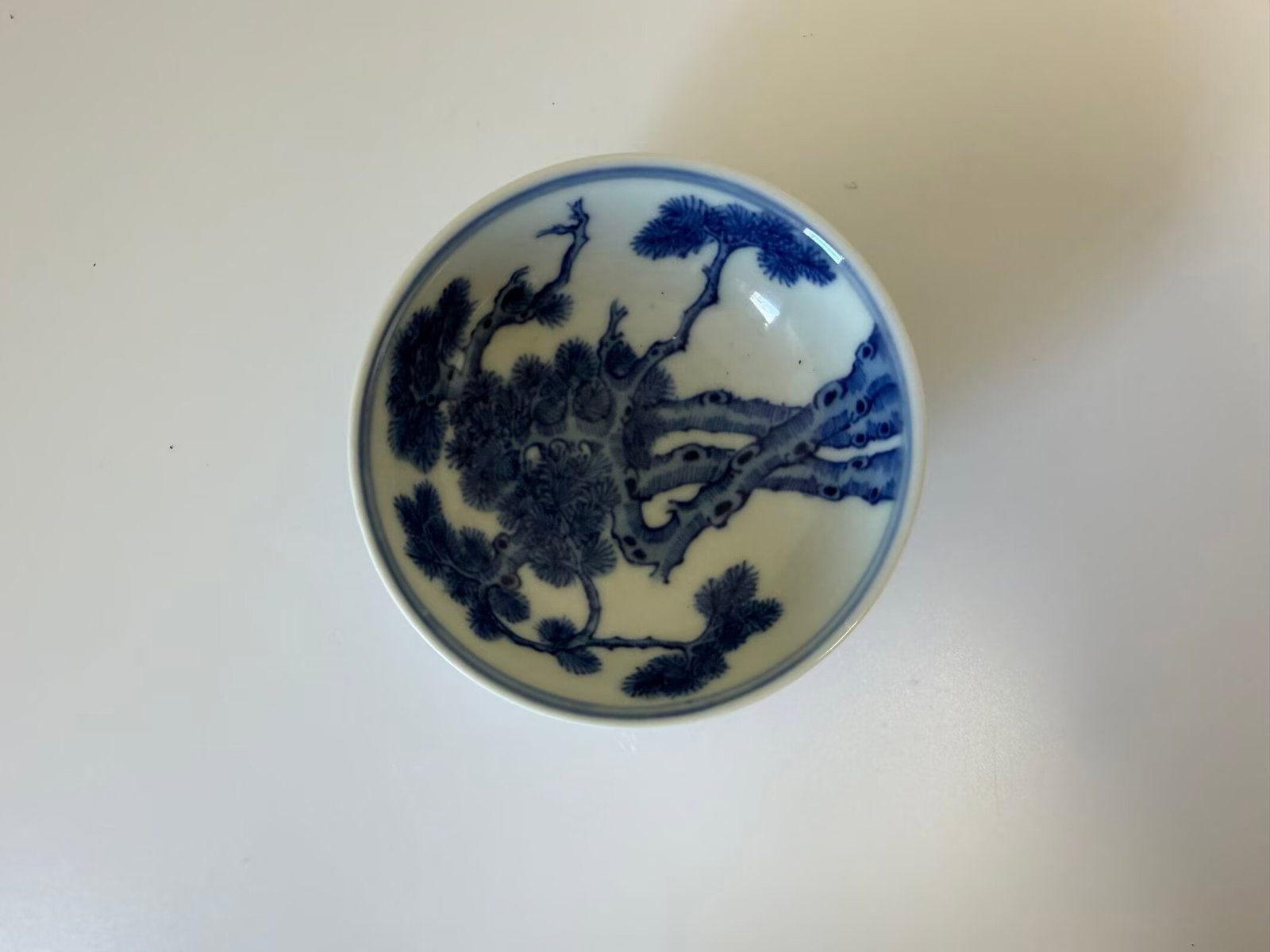 Chinese blue and white pine tree bats porcelain saucer with mark: Dimension: 3.3 inches , please note Due to manual measurement, dimensions may vary. Condition: Good used condition, please note buyers are obligated to come to the site to inspect the condition and